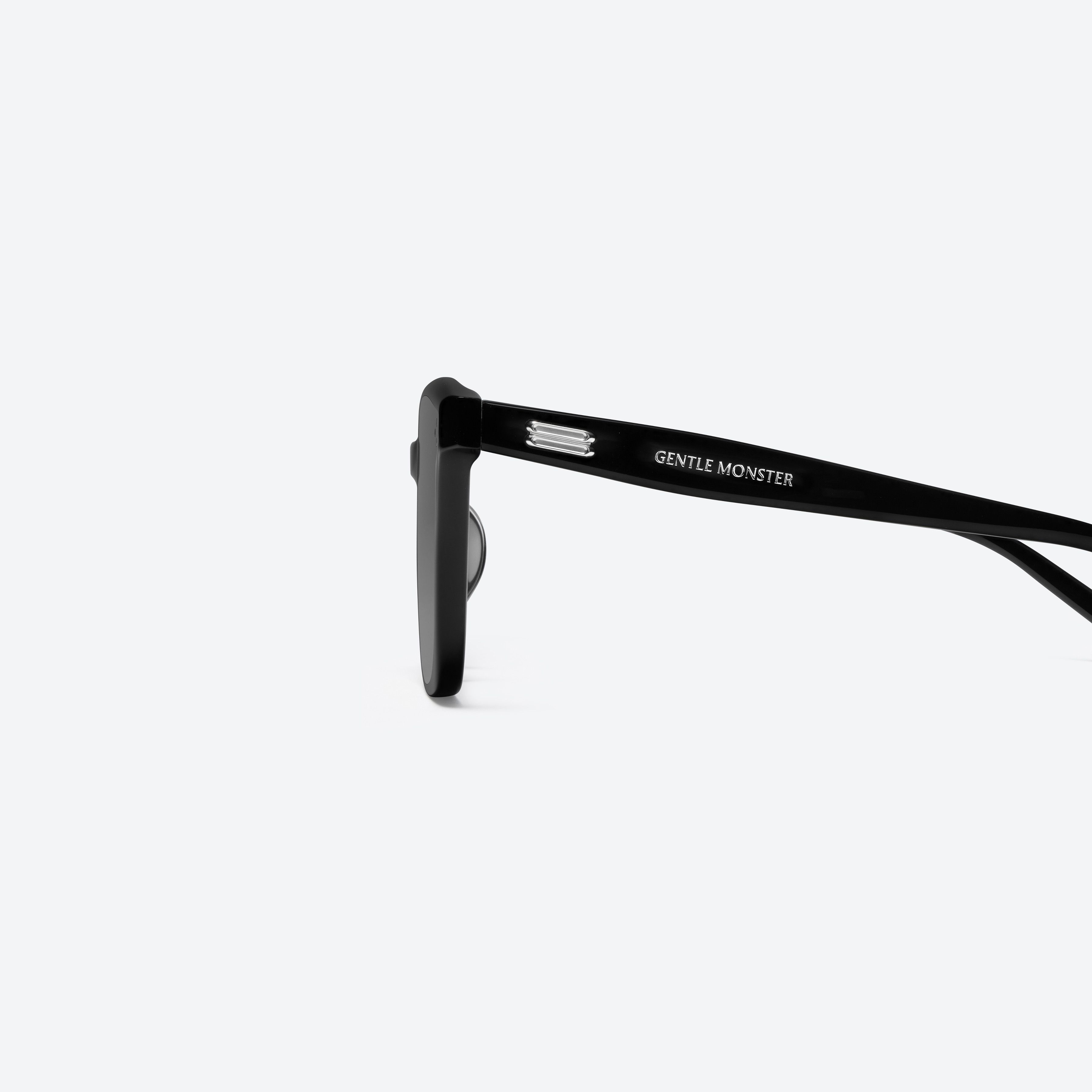 A detailed left view of Gentle Monster Gent 01 Recycled Similar Black Acetate Renew framed Square sunglasses.