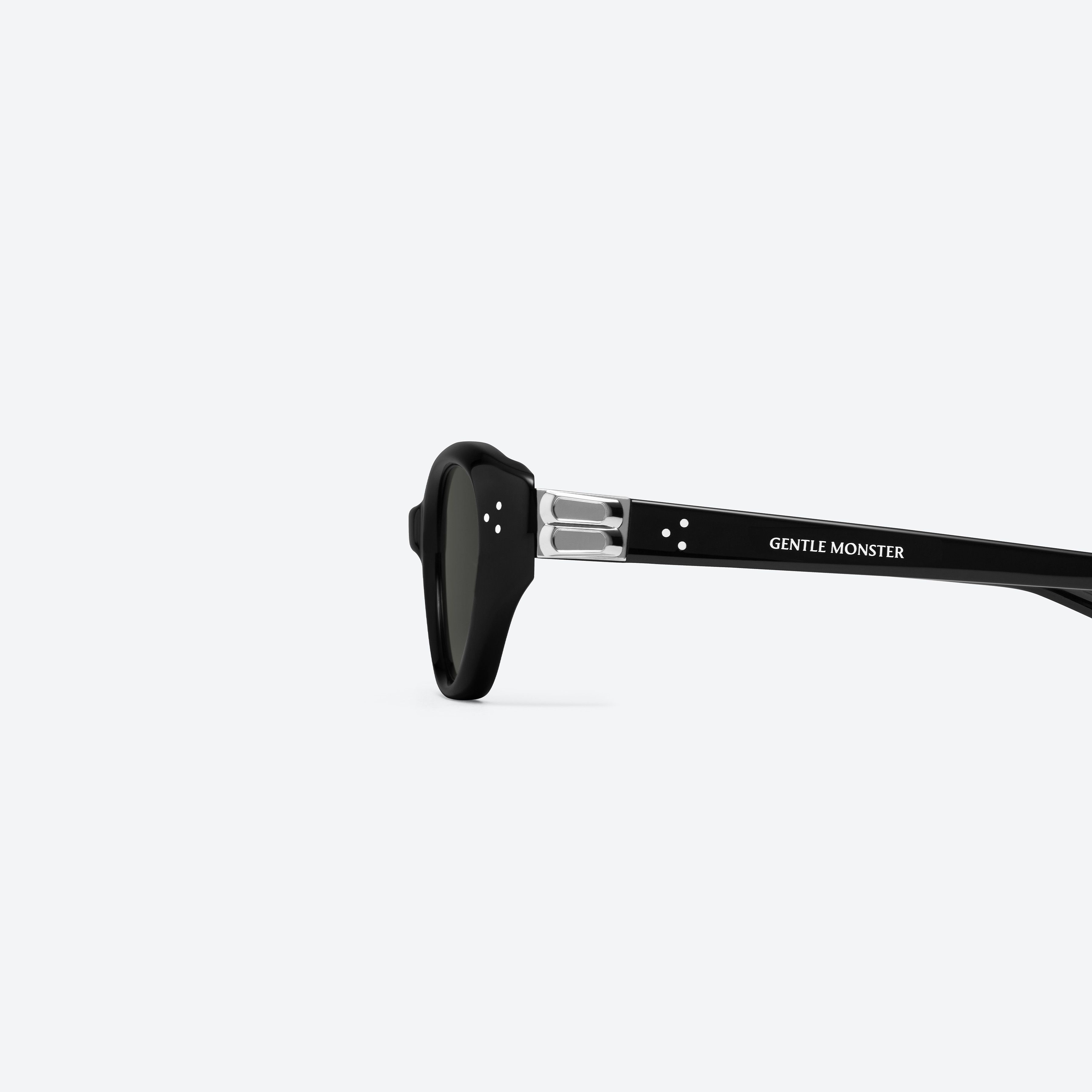 A detailed left view of Gentle Monster Vanilla 01 Recycled Similar Black Acetate Renew framed Cat-eye sunglasses.