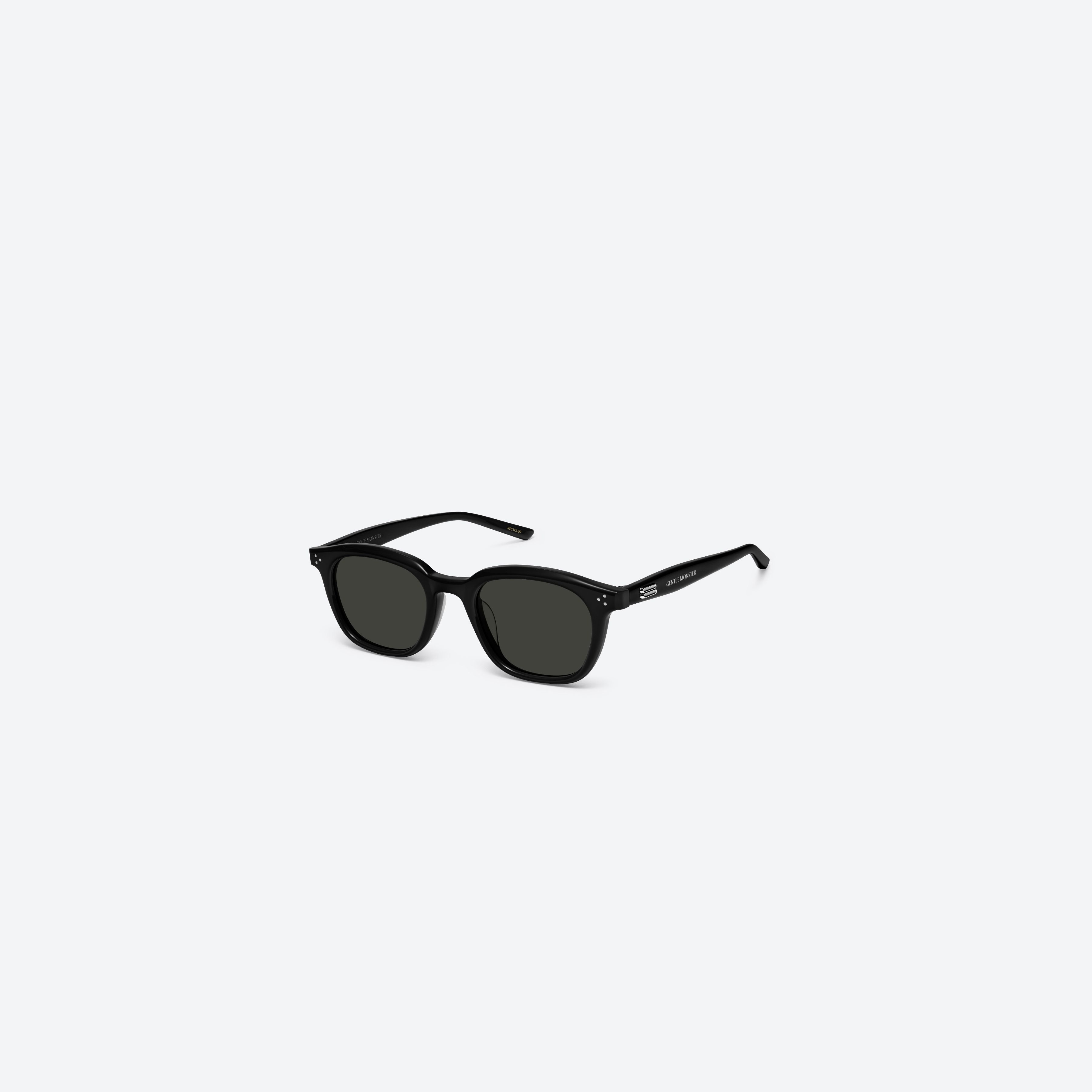 45-degree view of Gentle Monster Noho 01 Recycled Similar Black Acetate Renew framed Round sunglasses.