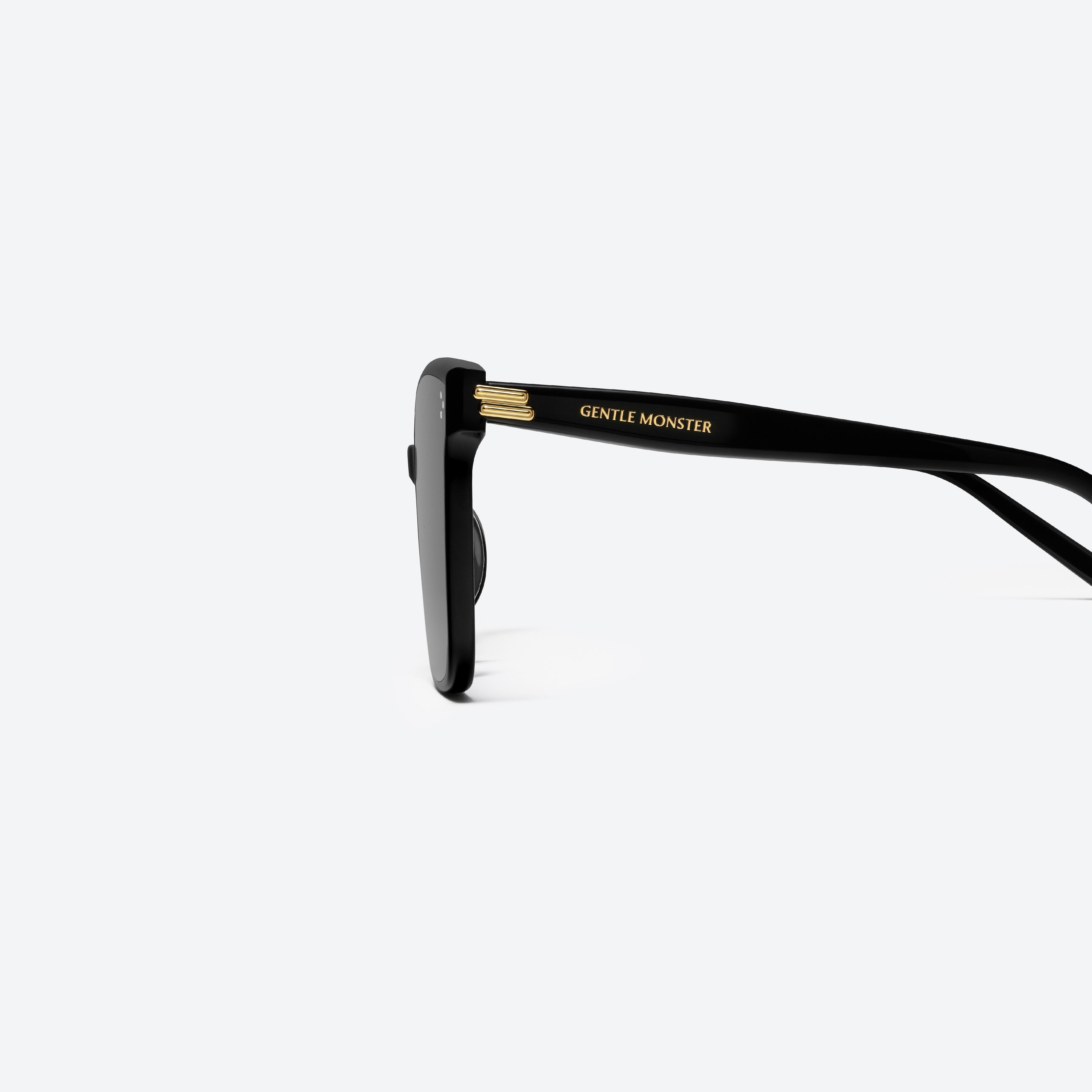 A detailed left view of Gentle Monster New Her 01 Recycled Similar Black Acetate Renew framed Square sunglasses.