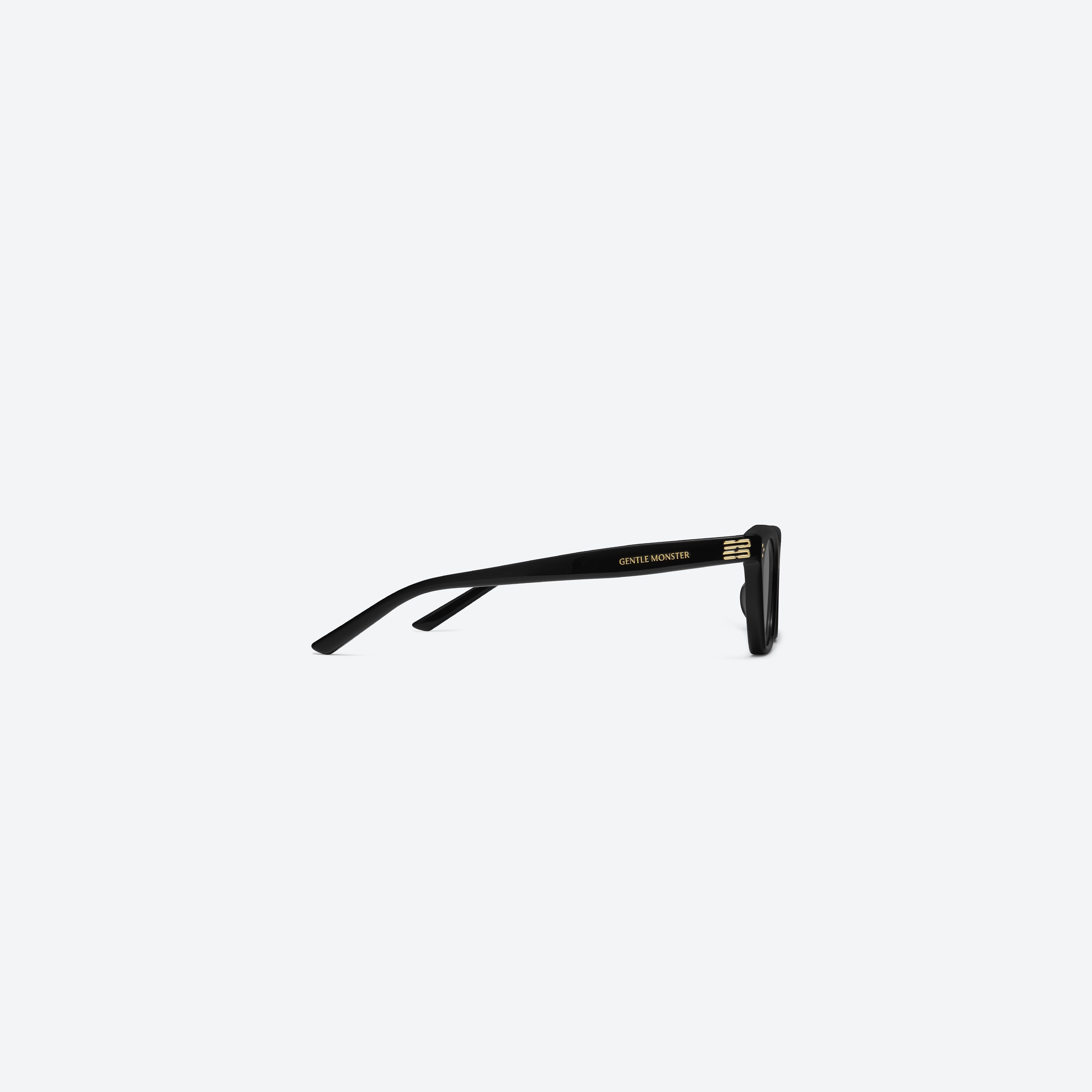 A detailed right view of Gentle Monster Gisele 01 Recycled Similar Black Acetate Renew framed Cat-eye sunglasses.