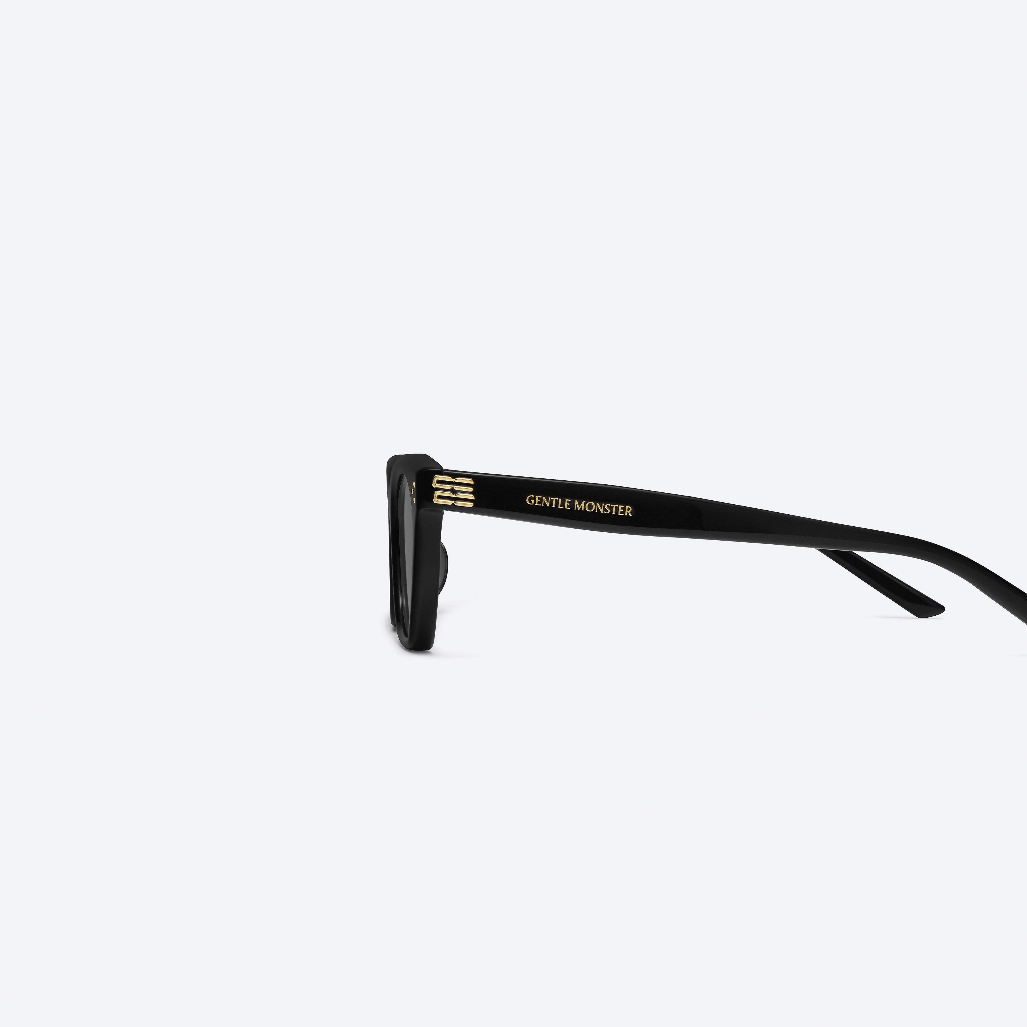 A detailed left view of Gentle Monster Gisele 01 Recycled Similar Black Acetate Renew framed Cat-eye sunglasses.