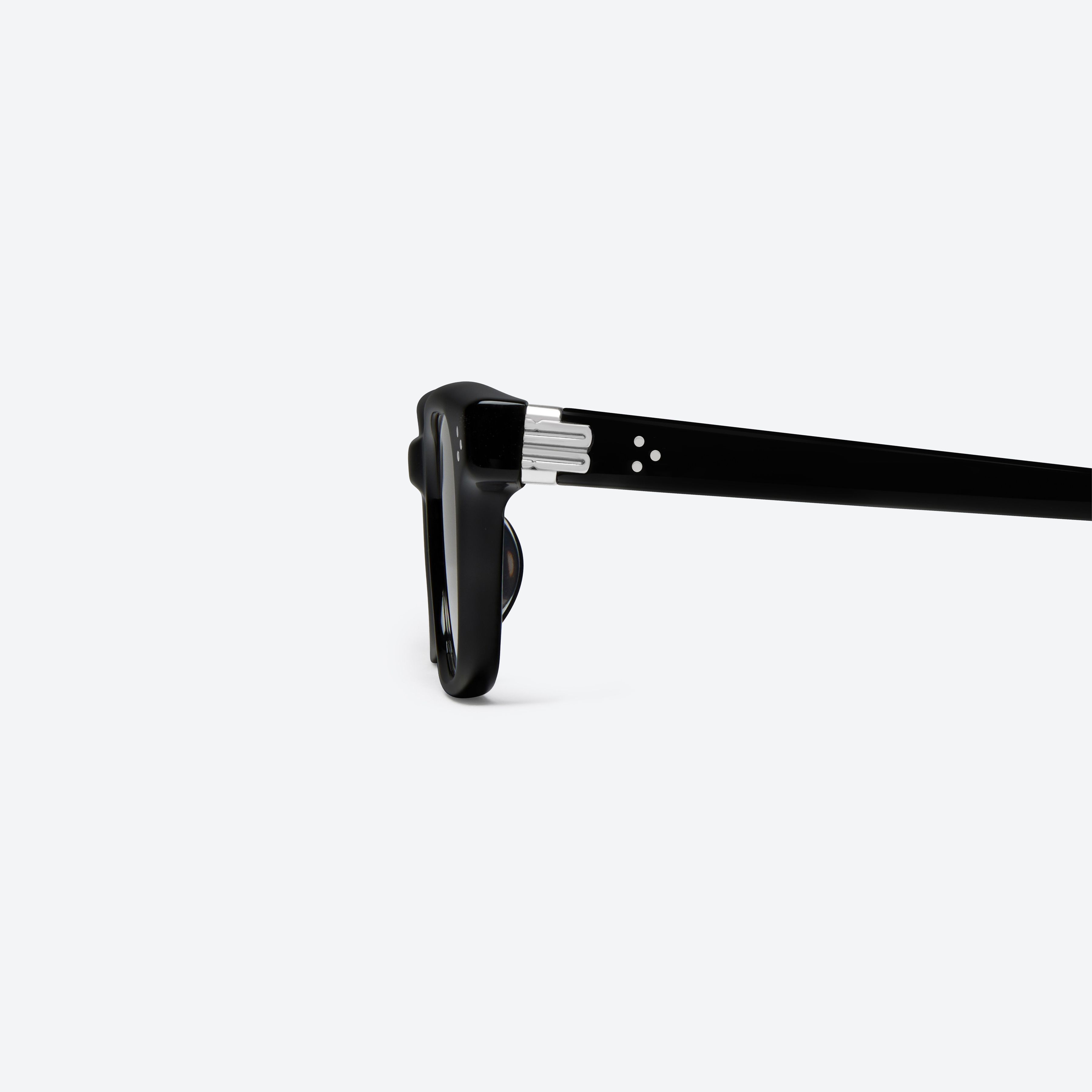 A detailed left view of Gentle Monster Jane 01(g) Black Acetate framed Cat-eye sunglasses.