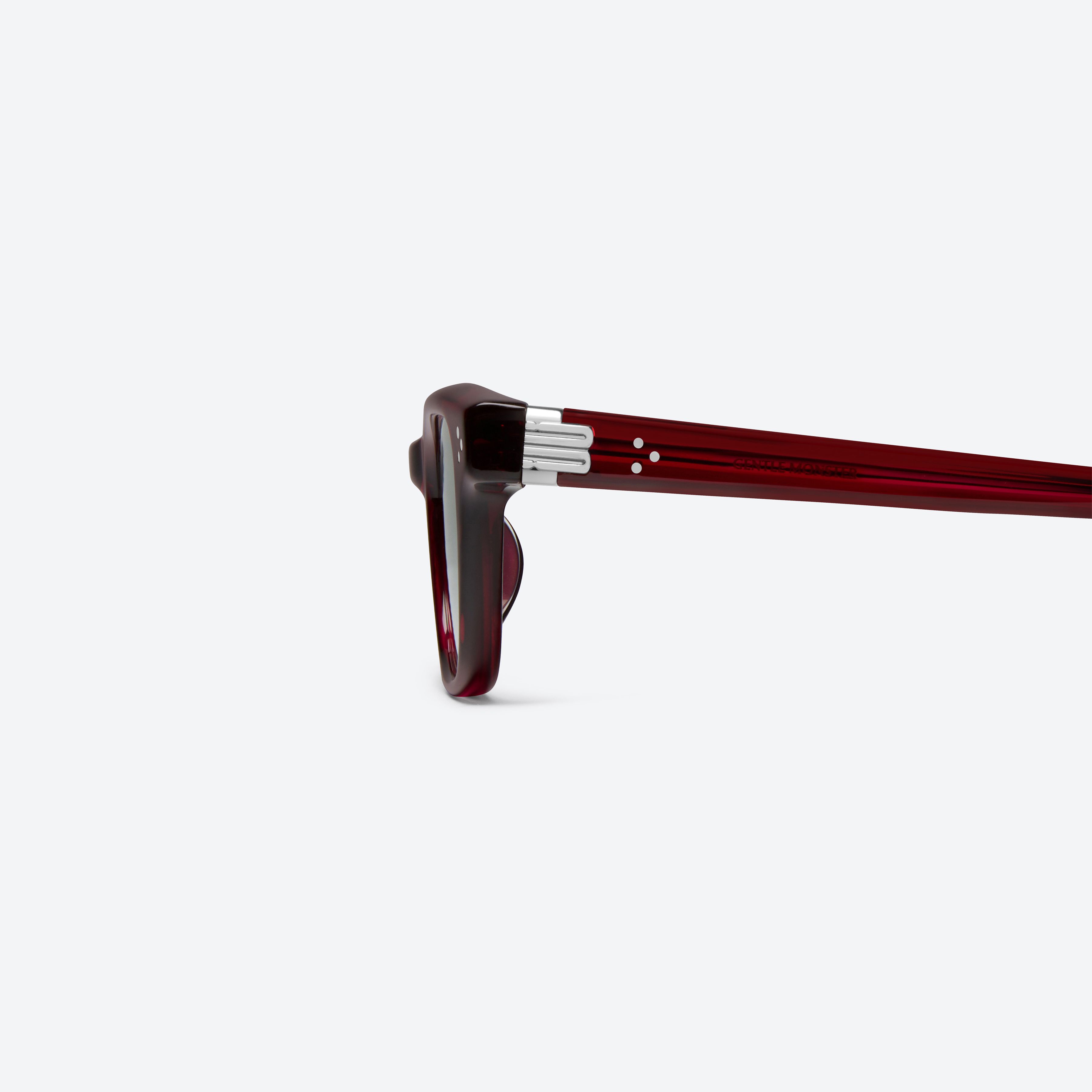 A detailed left view of Gentle Monster Jane Rc7 Red Acetate framed Cat-eye sunglasses.
