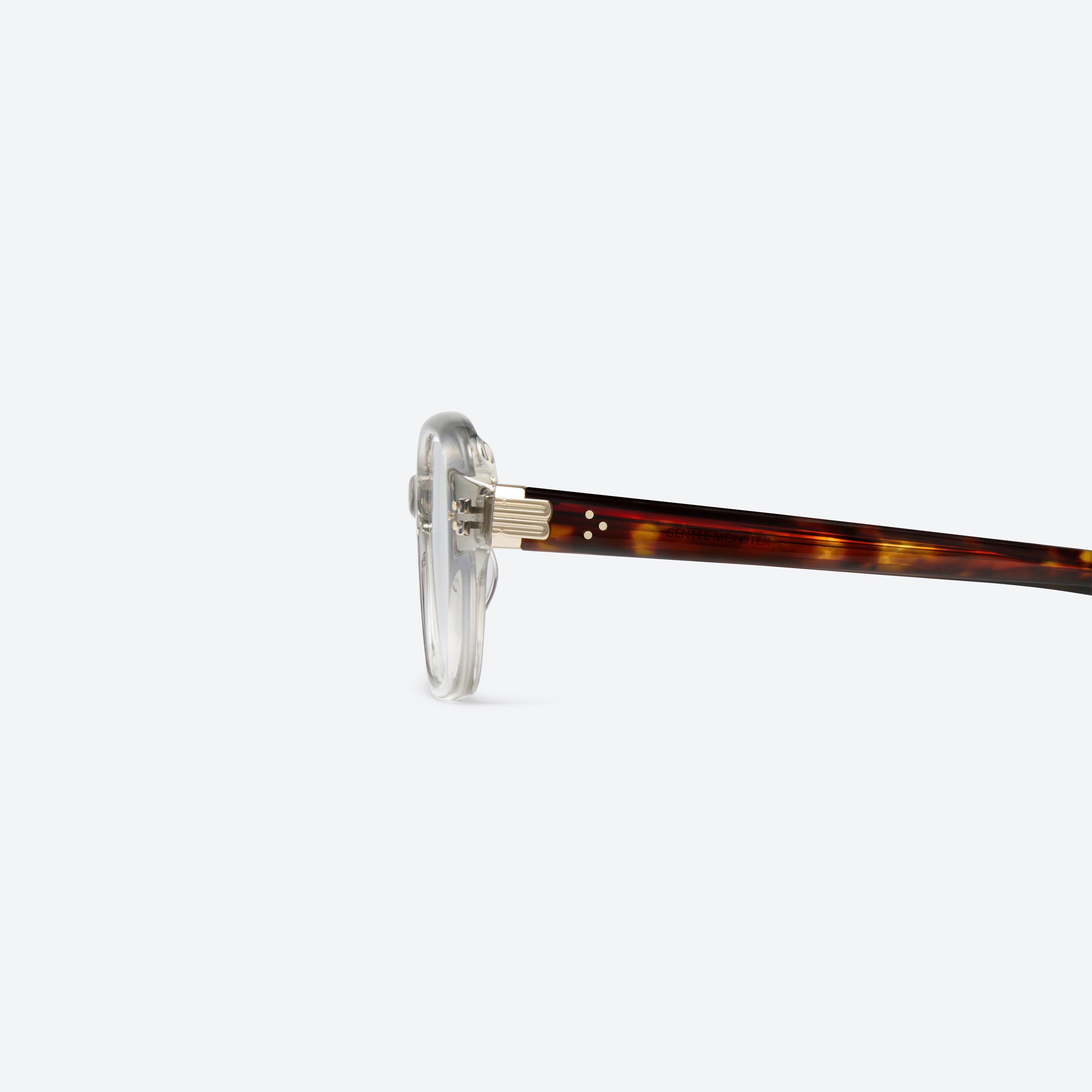 A detailed left view of Gentle Monster Ella Brc11 Brown Acetate framed Square glasses.