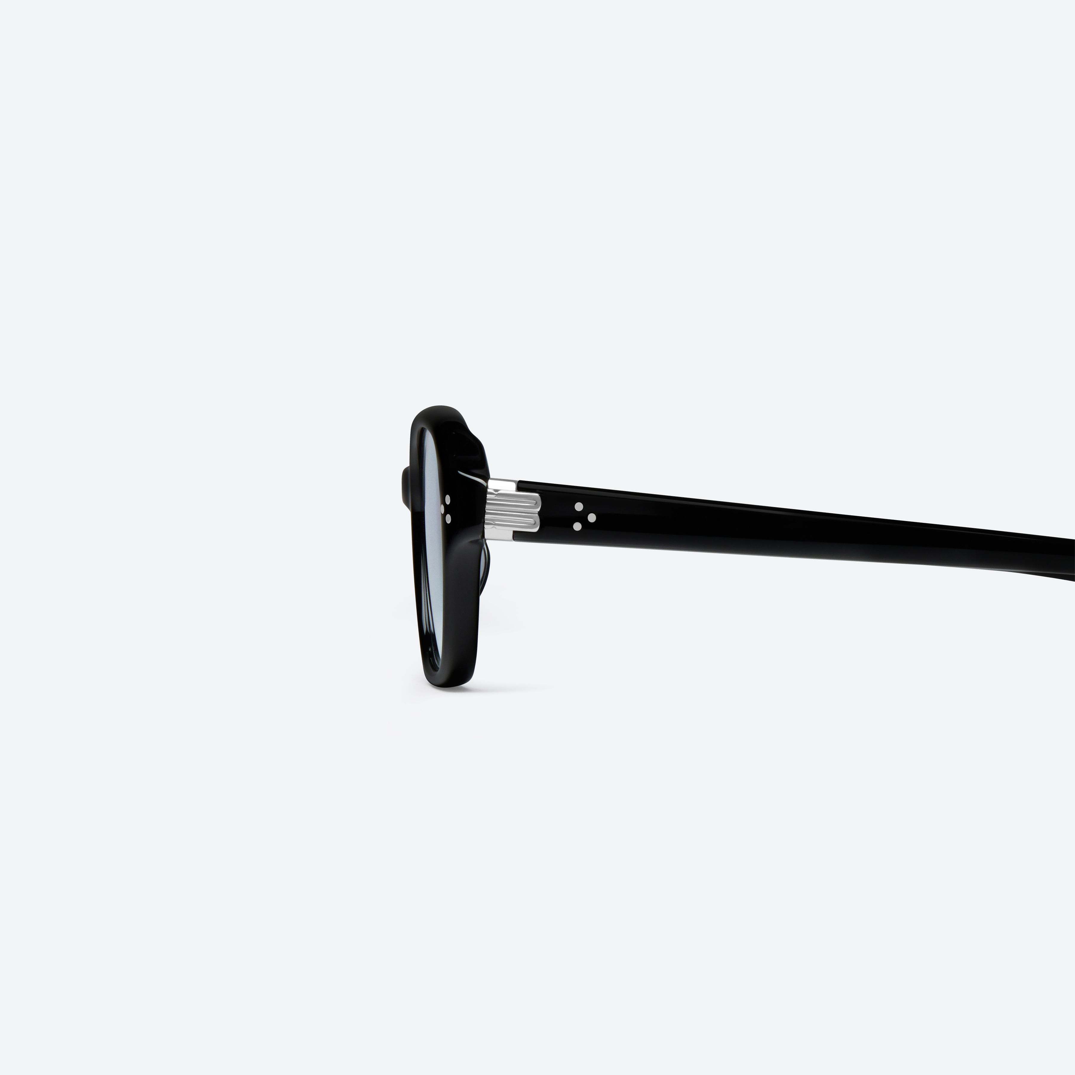 A detailed left view of Gentle Monster Ella 01 Black Acetate framed Square sunglasses.