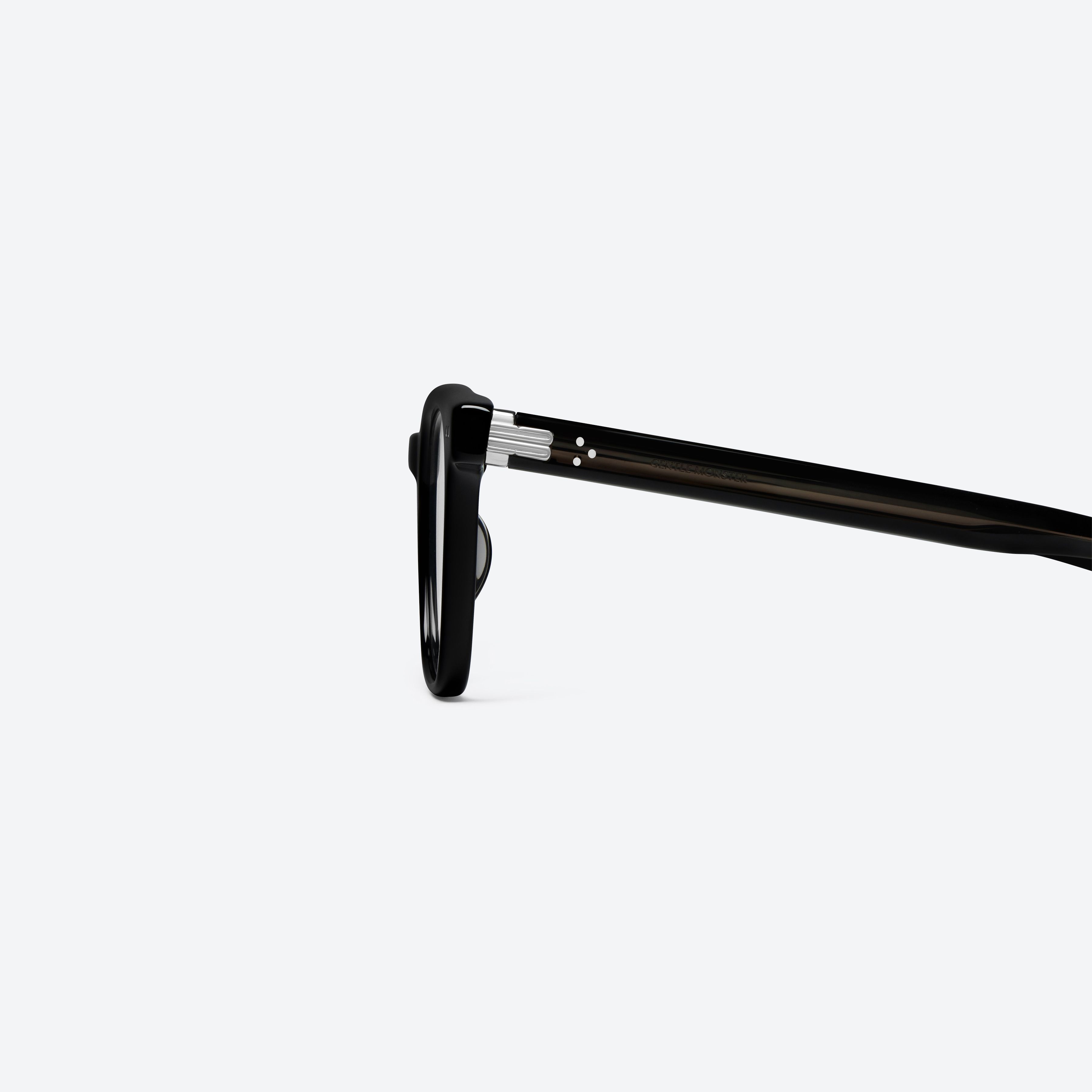 A detailed left view of Gentle Monster Cav 01 Black Acetate framed Square glasses.