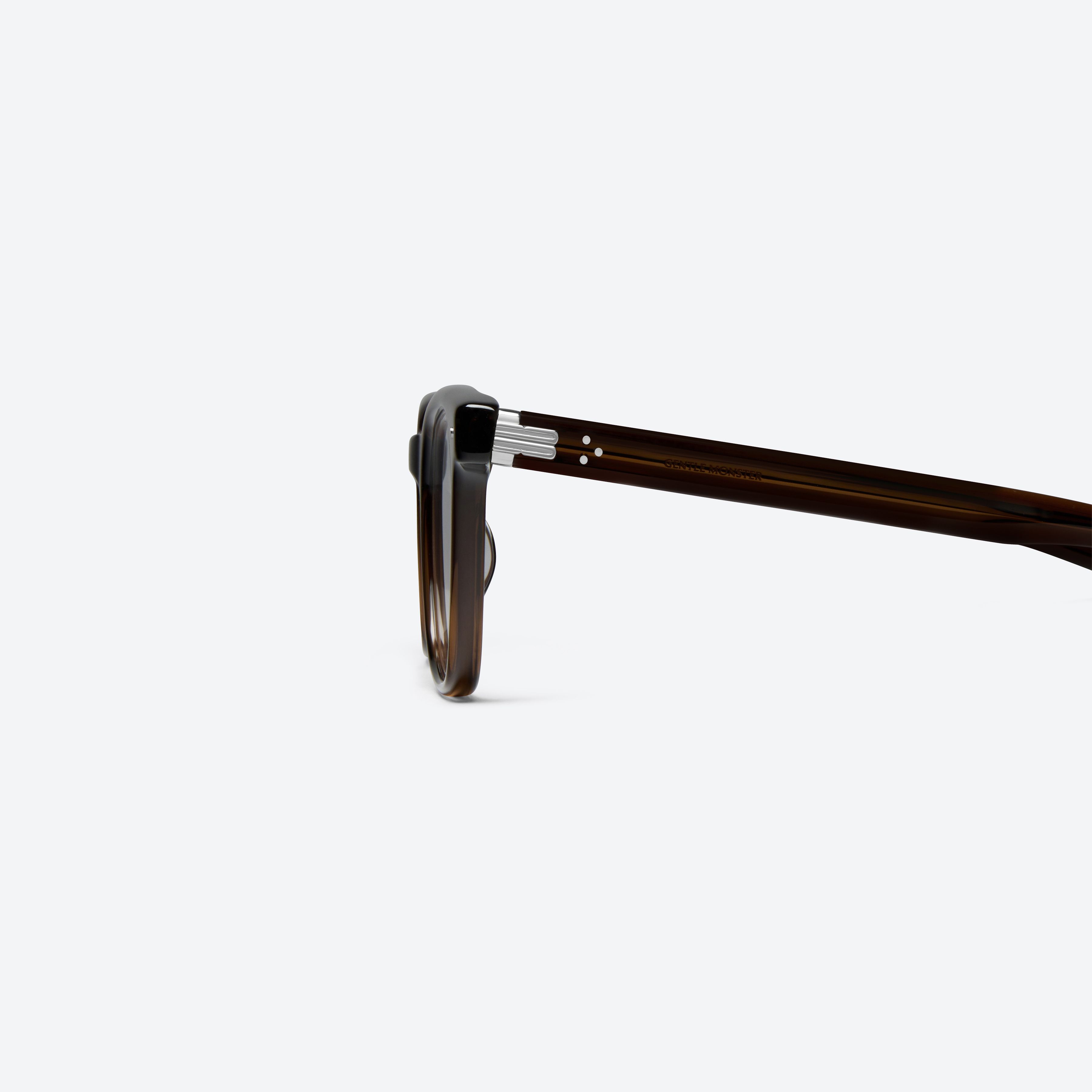 A detailed left view of Gentle Monster Cav Brc14 Brown Acetate framed Square glasses.