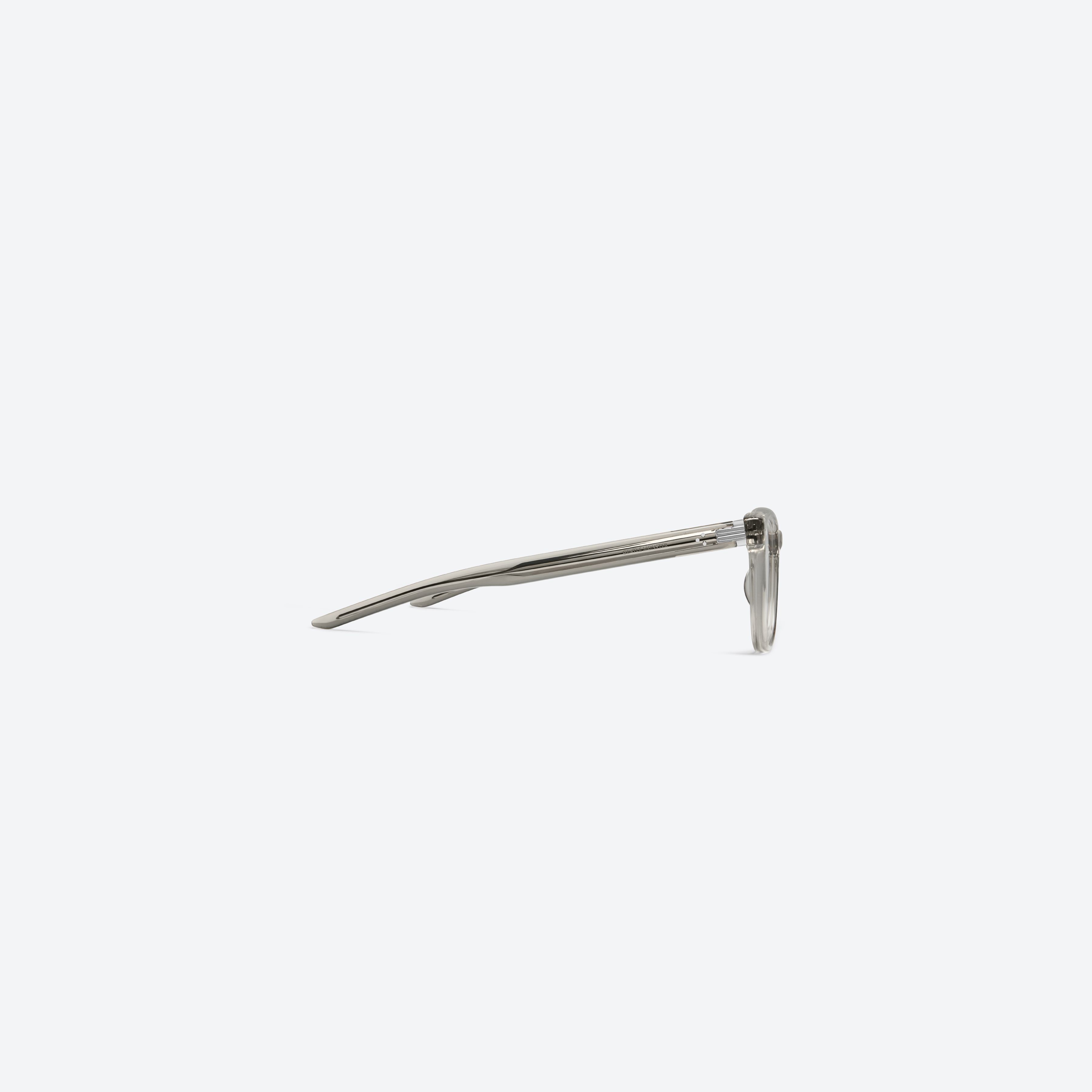 A detailed right view of Gentle Monster Cav Brc11 Similar Brown Acetate framed Square glasses.