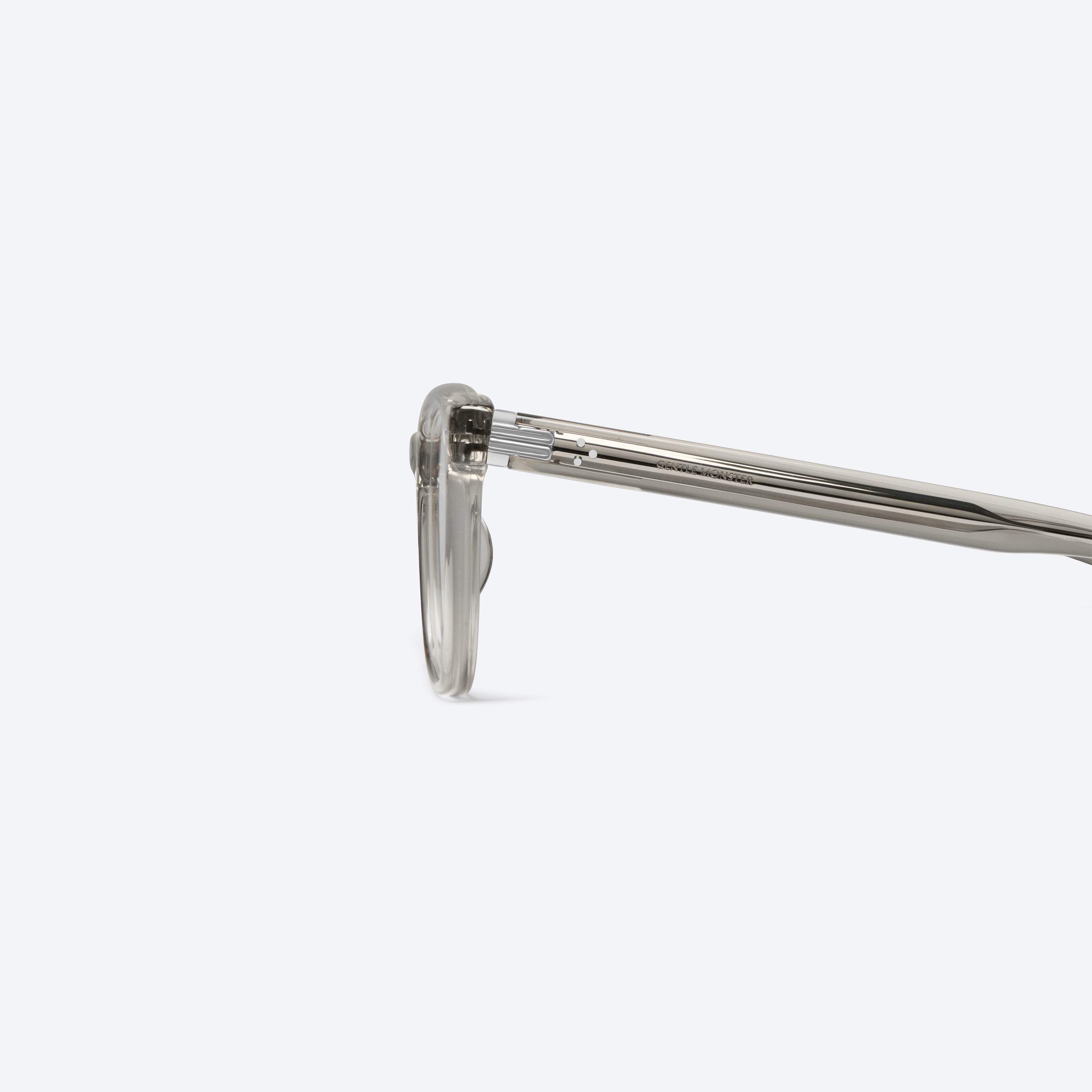 A detailed left view of Gentle Monster Cav Brc11 Similar Brown Acetate framed Square glasses.