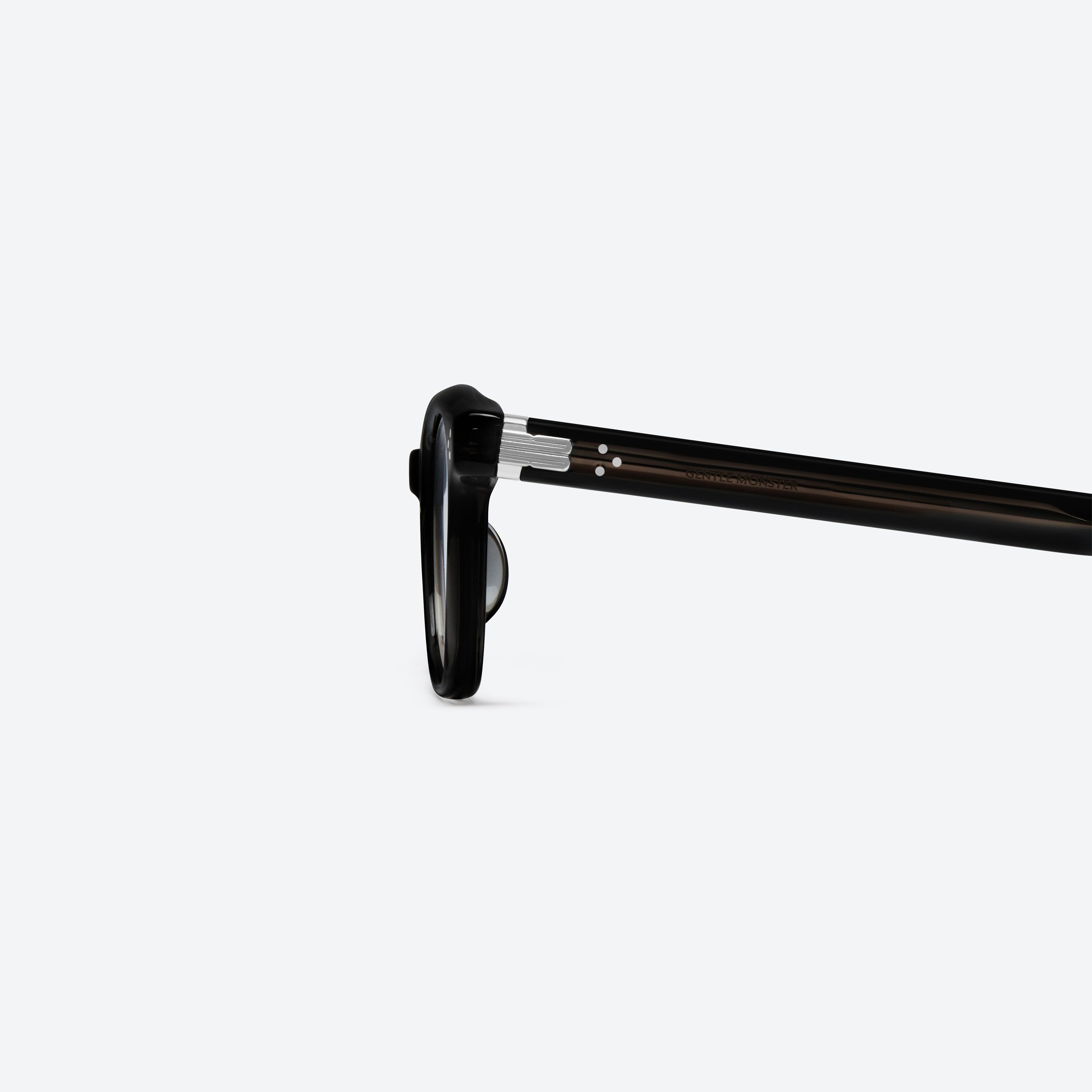 A detailed left view of Gentle Monster Cord 01 Black Acetate framed Square glasses.