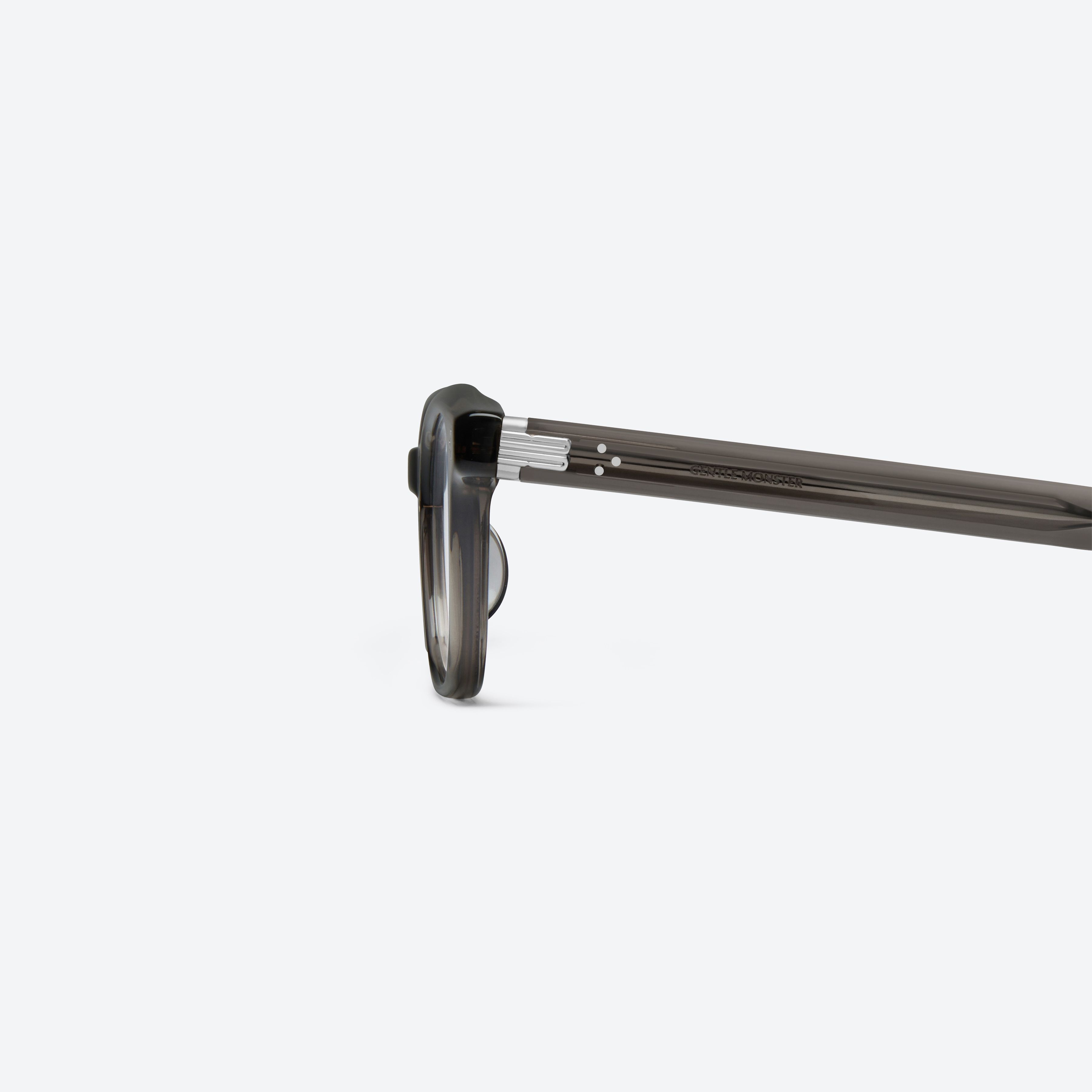 A detailed left view of Gentle Monster Cord Brc17 Brown Acetate framed Square glasses.