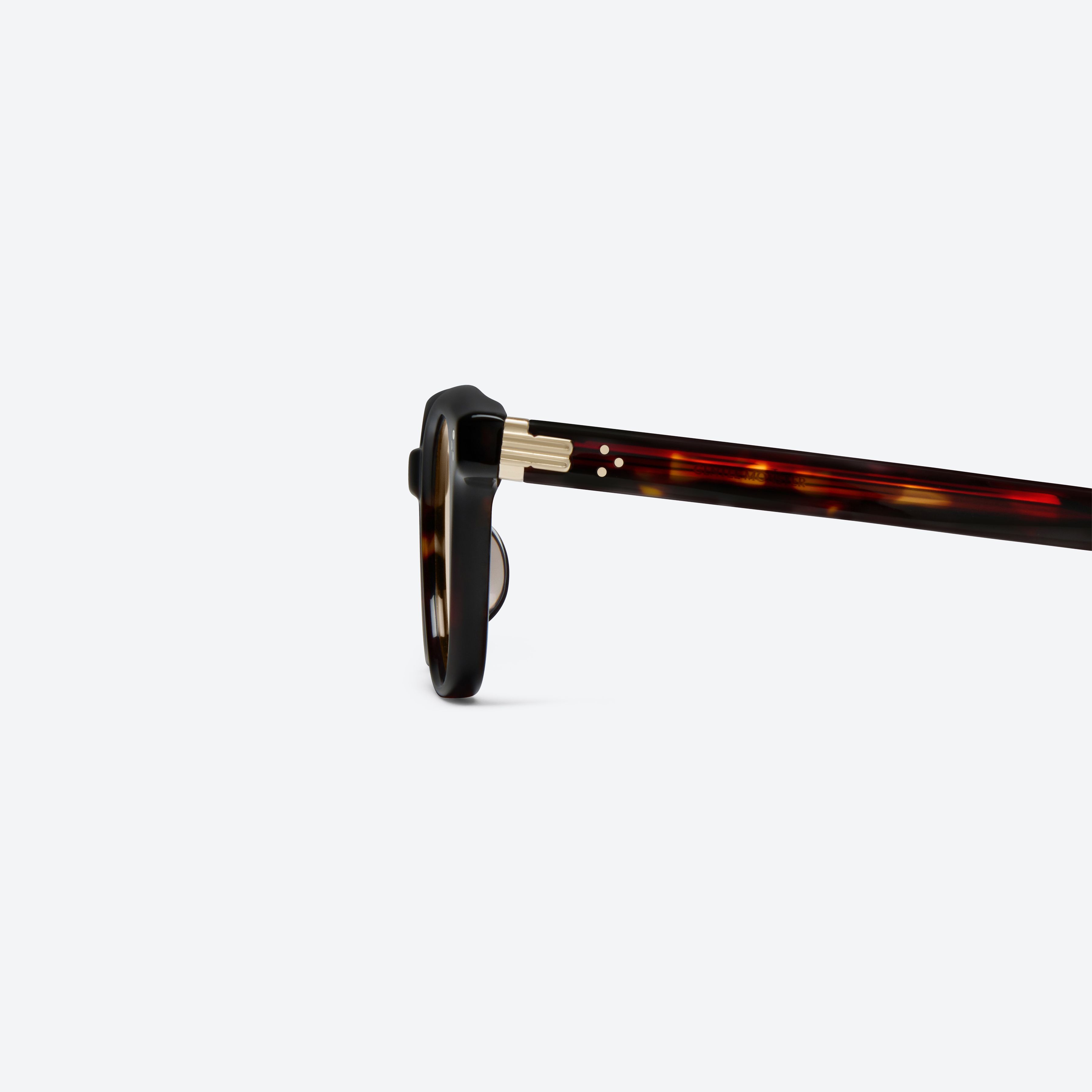 A detailed left view of Gentle Monster Cord T1 Tortoise Acetate framed Square sunglasses.