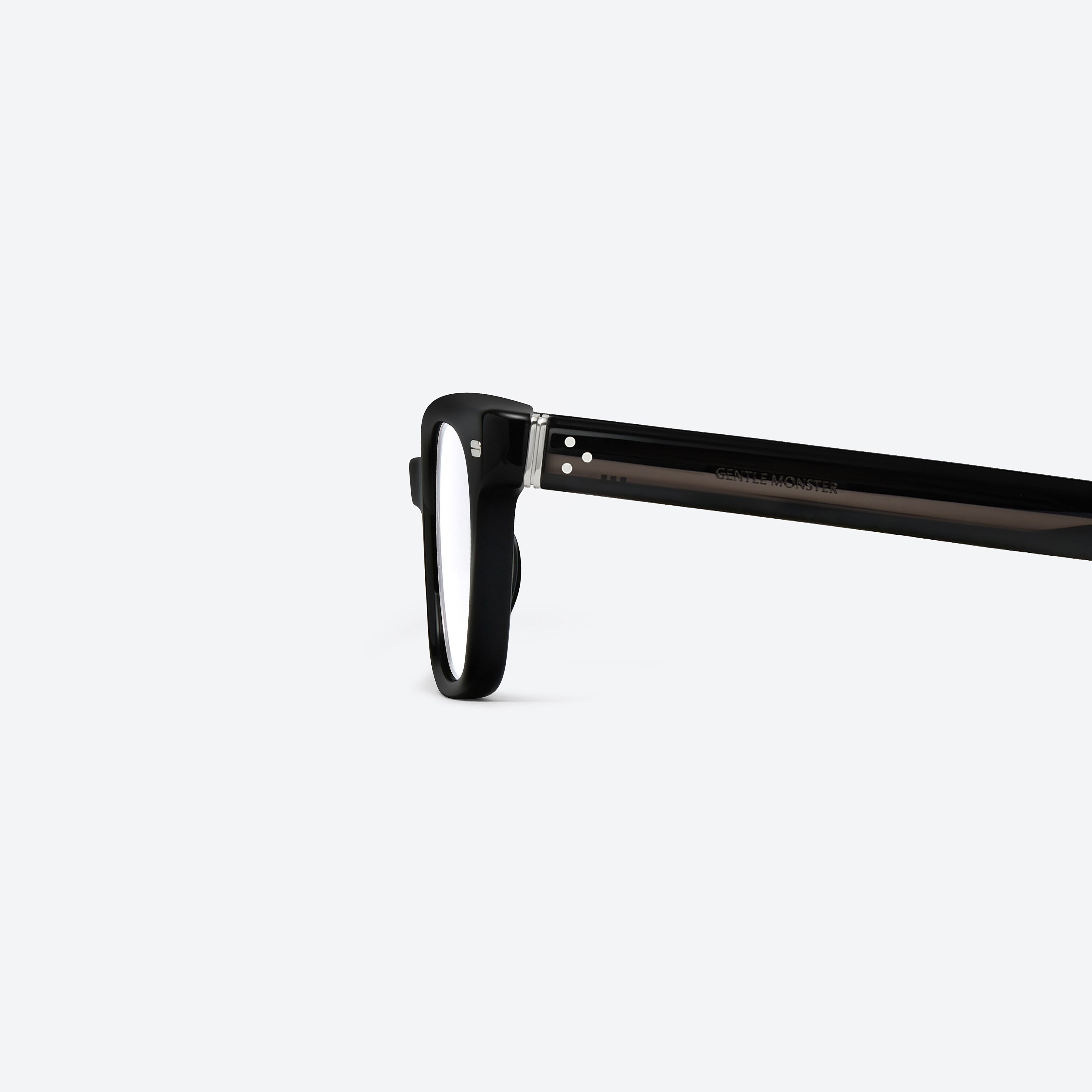 A detailed left view of Gentle Monster Ade 01 Black Acetate framed Square glasses.