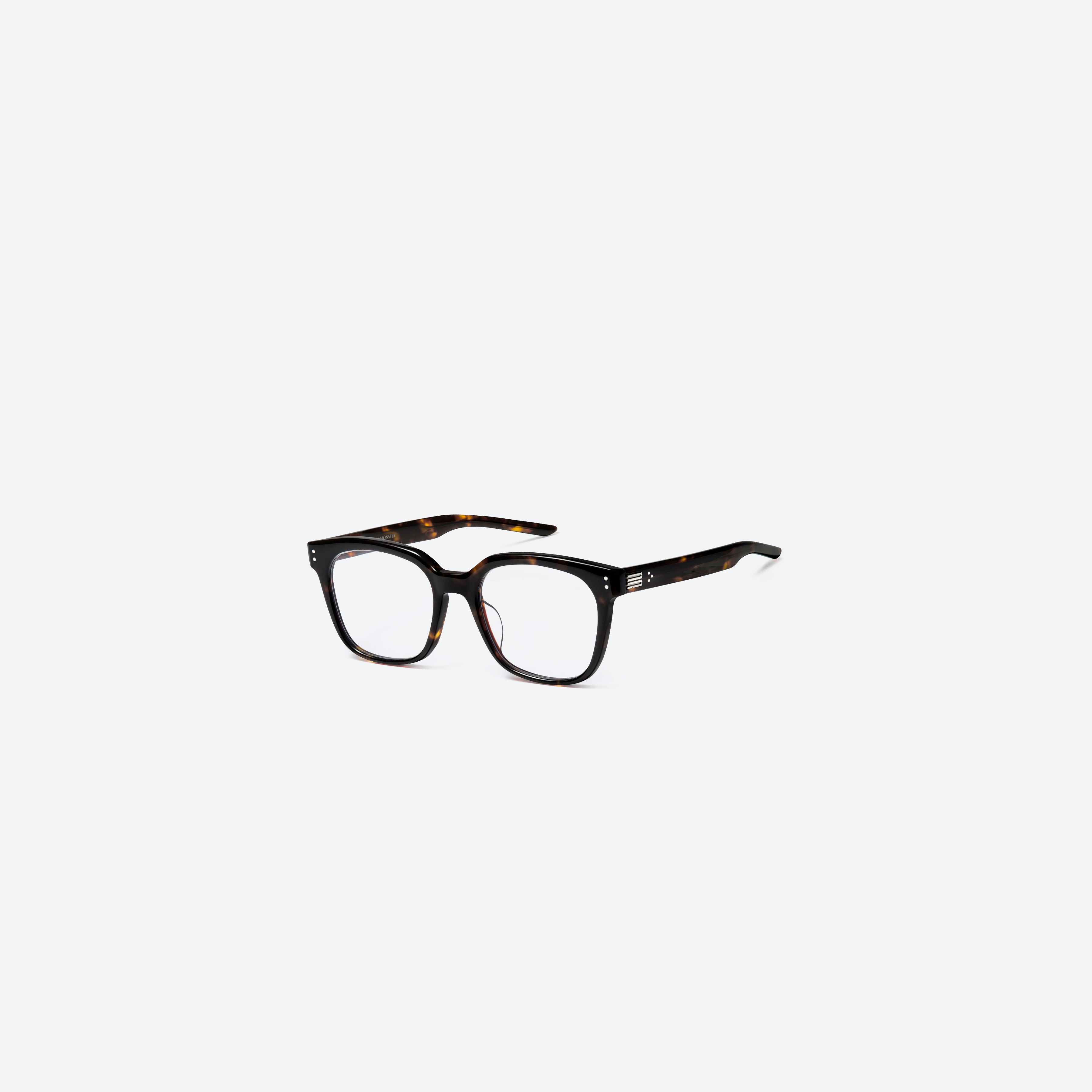 45-degree view of Gentle Monster Una.c W T1 Tortoise Acetate framed Square glasses.