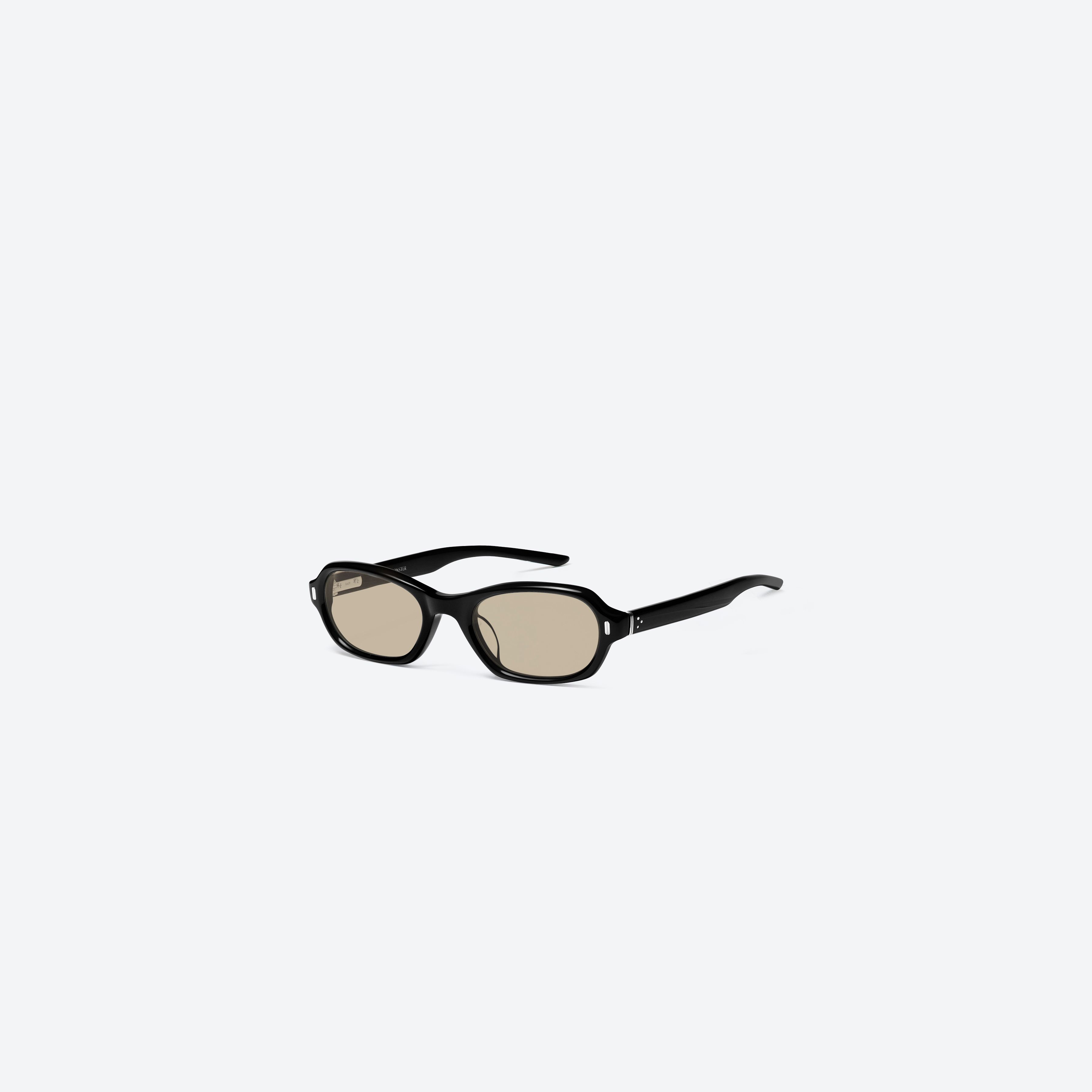 45-degree view of Gentle Monster Cai 01 Black Acetate framed Aviator sunglasses.