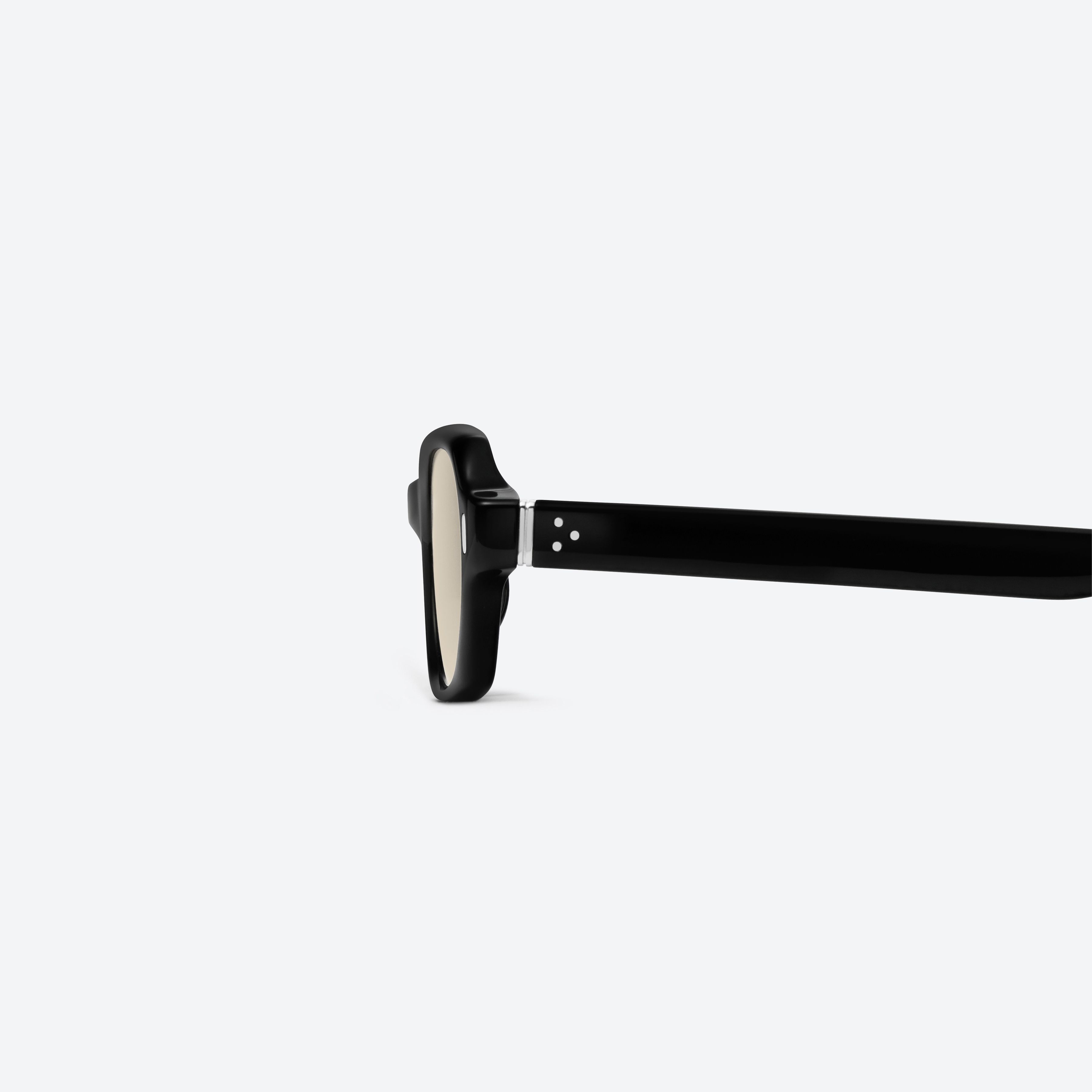 A detailed left view of Gentle Monster Cai 01 Black Acetate framed Aviator sunglasses.