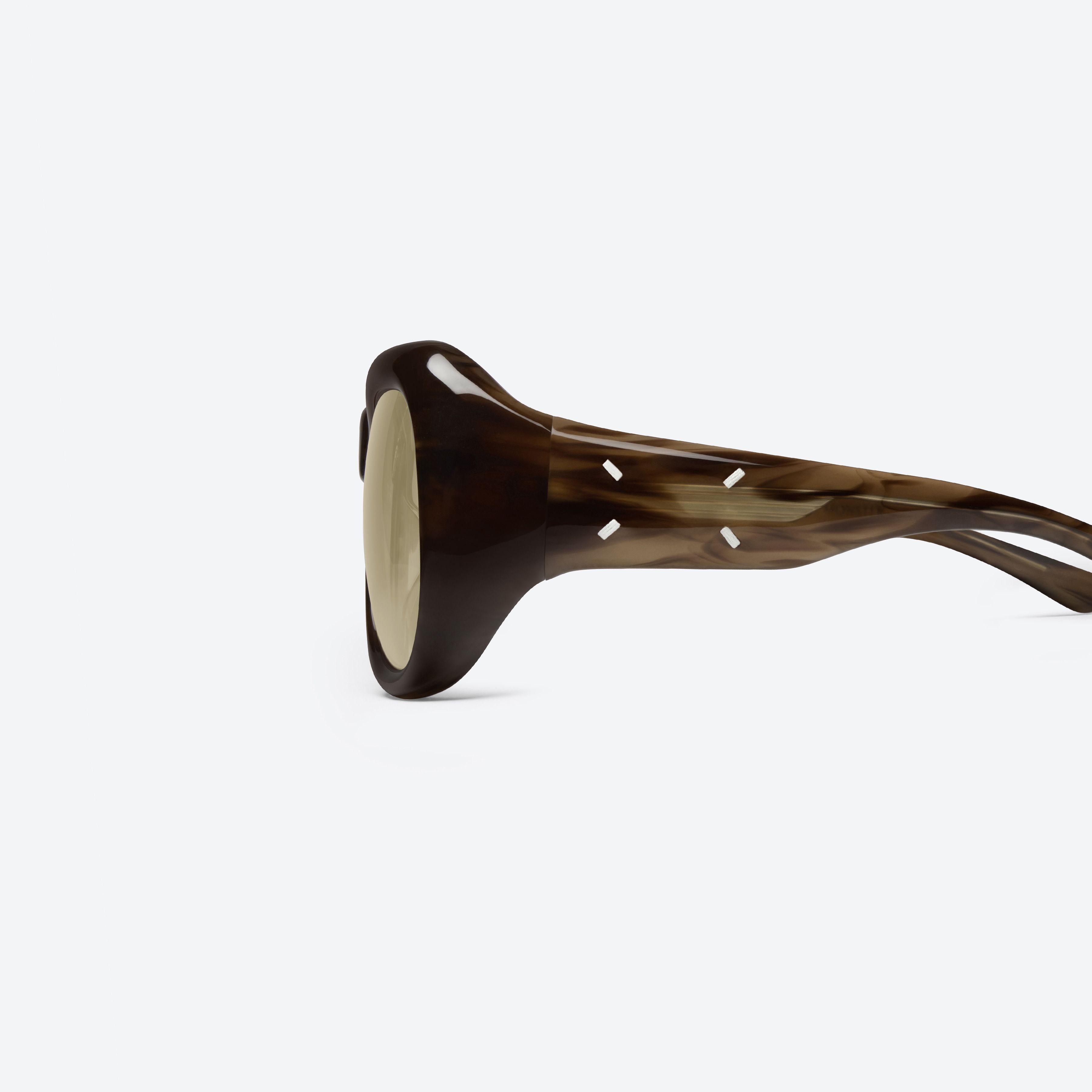 A detailed left view of Gentle Monster Maison Margiela - MM323 T14 Similar Tortoise Acetate framed Aviator sunglasses.