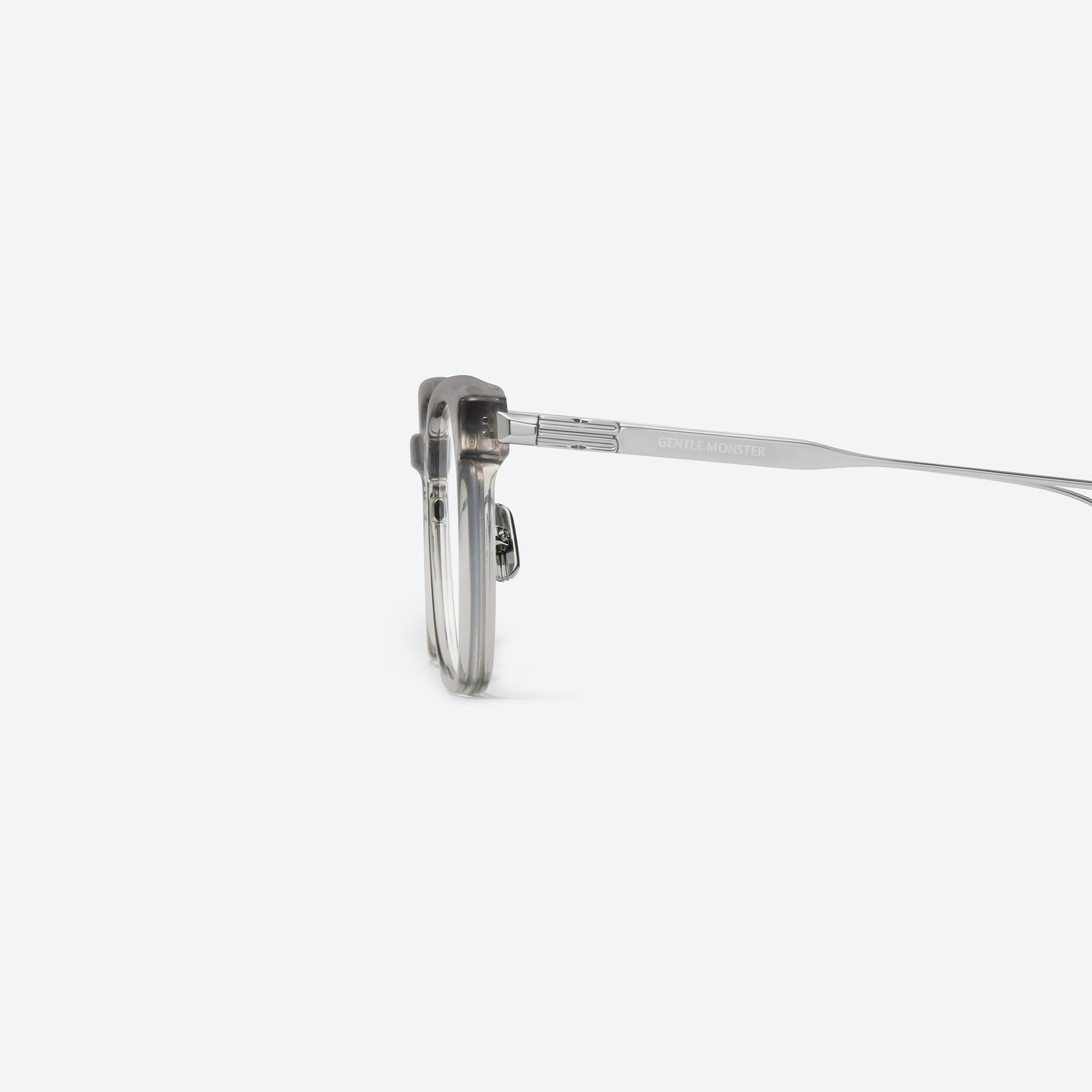 A detailed left view of Gentle Monster Noa Gc7 Gray Mixed framed Square glasses.
