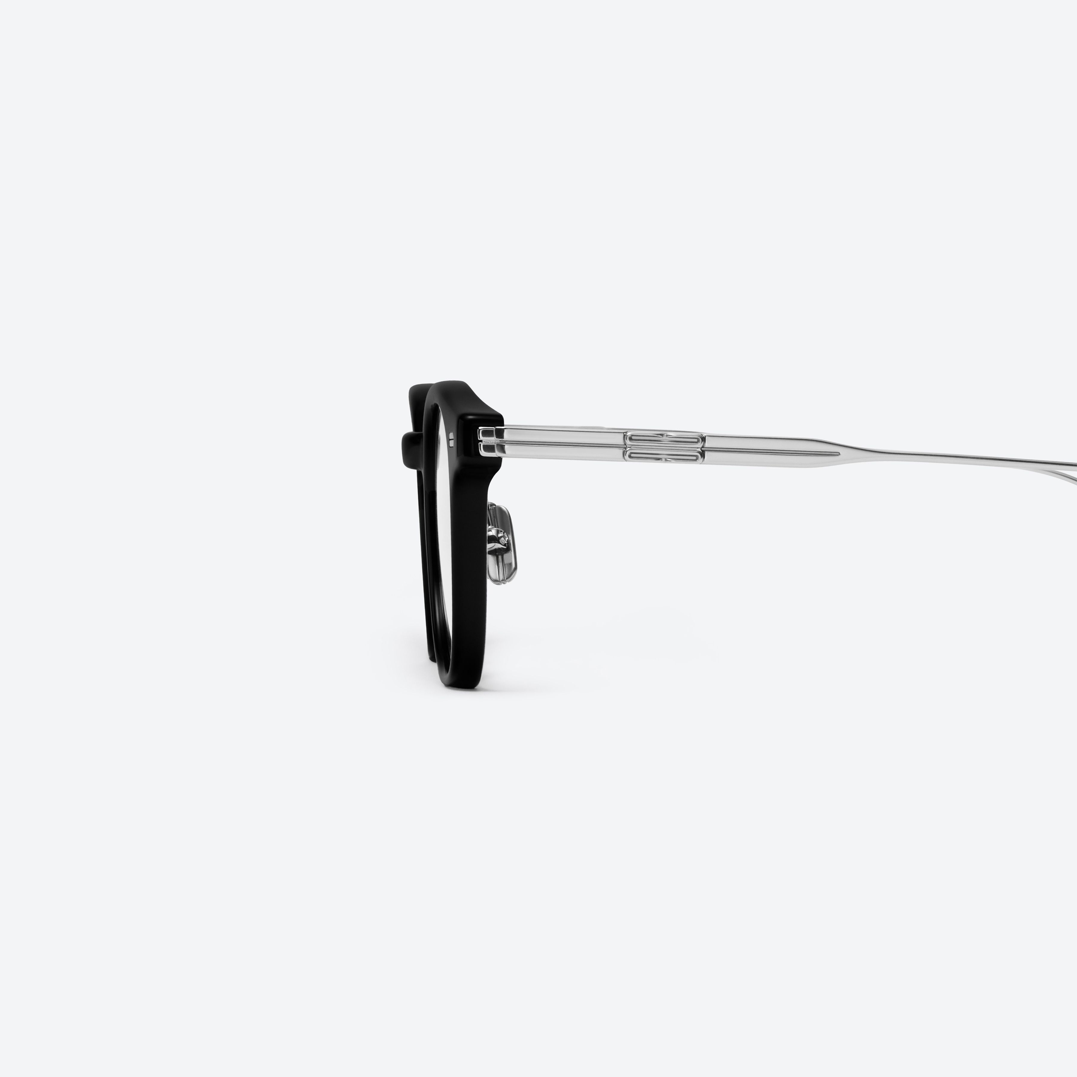 A detailed left view of Gentle Monster Odin 01 Black Mixed framed Square glasses.
