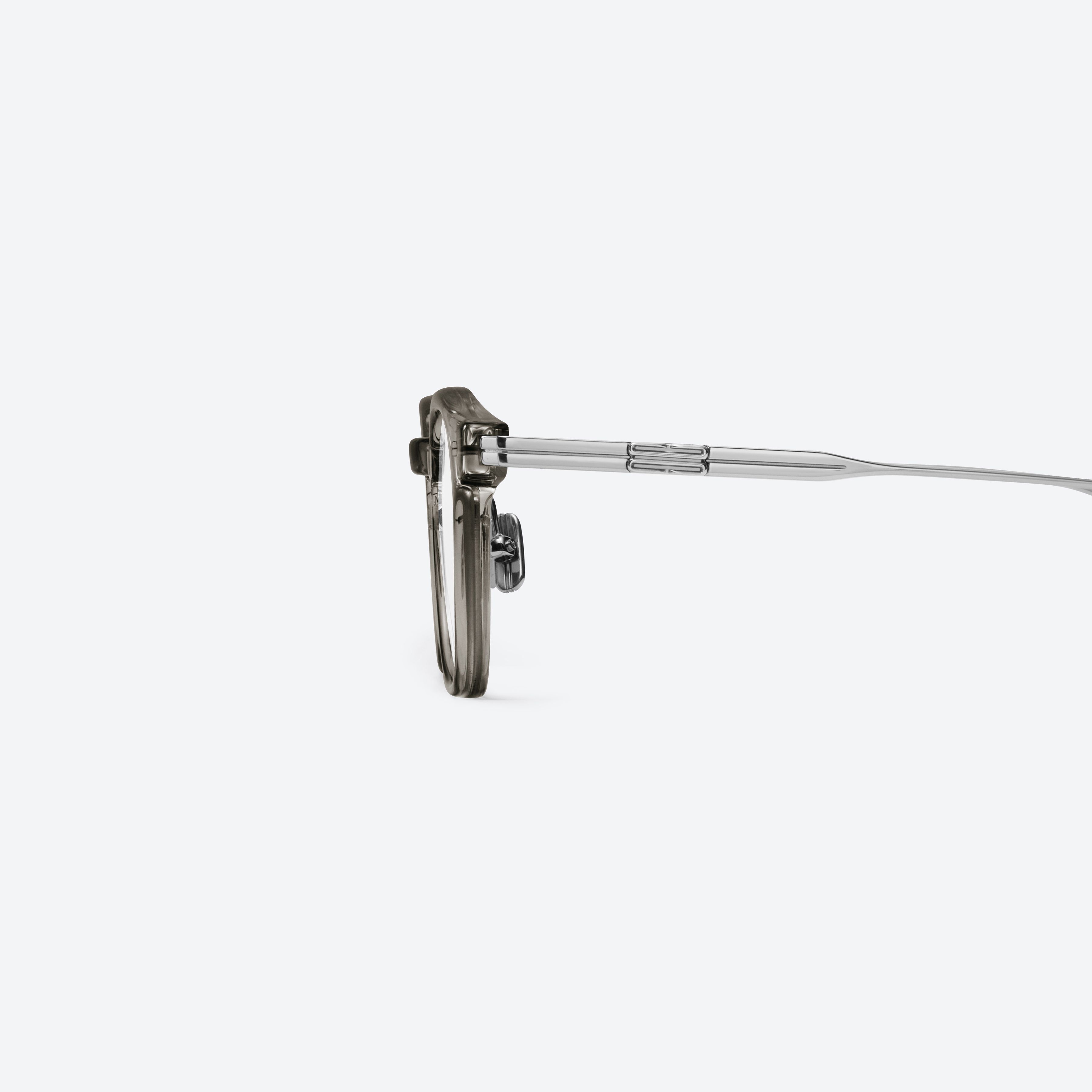 A detailed left view of Gentle Monster Odin Brc17 Similar Brown Mixed framed Square glasses.