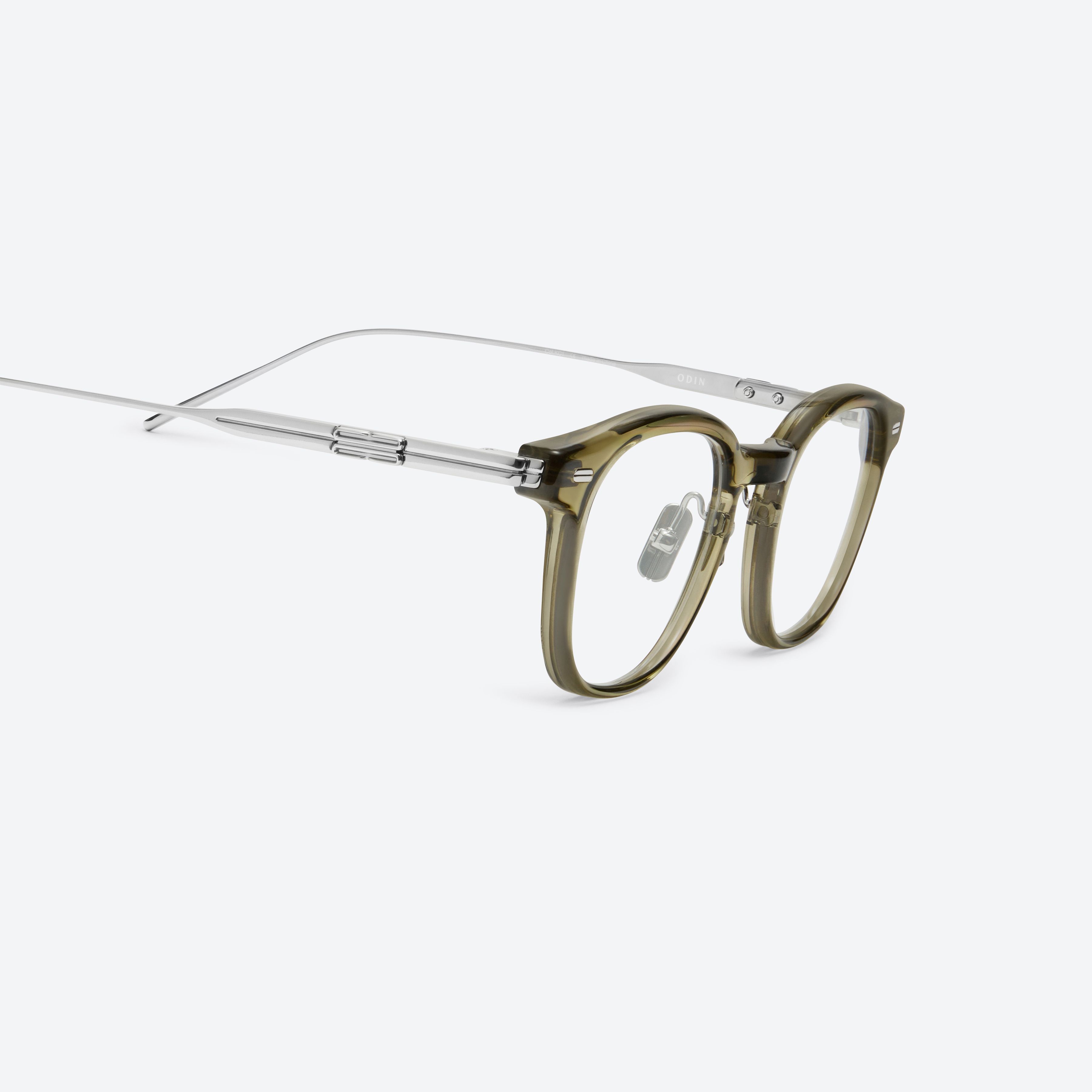 45-degree detailed view of Gentle Monster Odin Kc1 Green Mixed framed Square glasses.