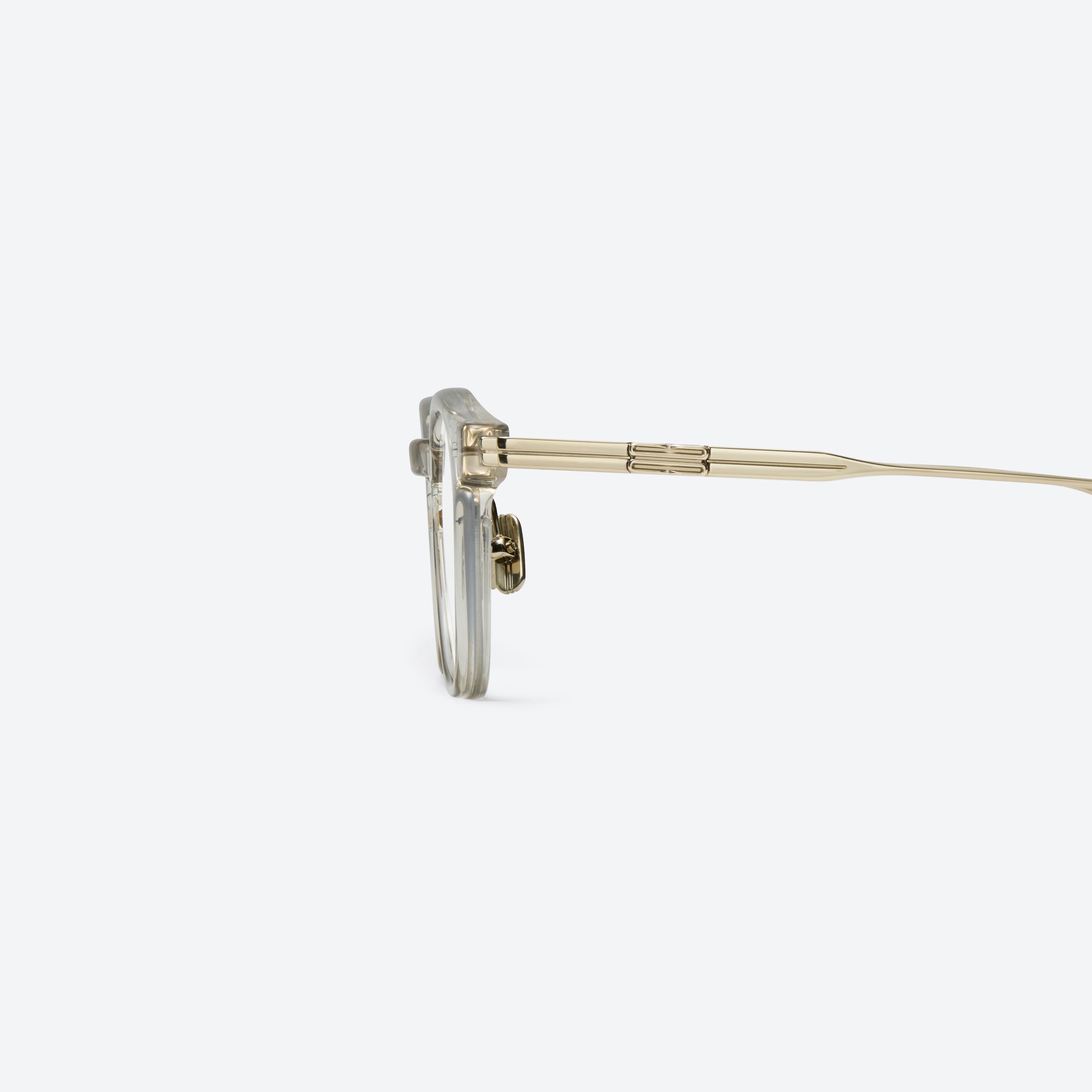A detailed left view of Gentle Monster Odin Brc23 Brown Mixed framed Square glasses.
