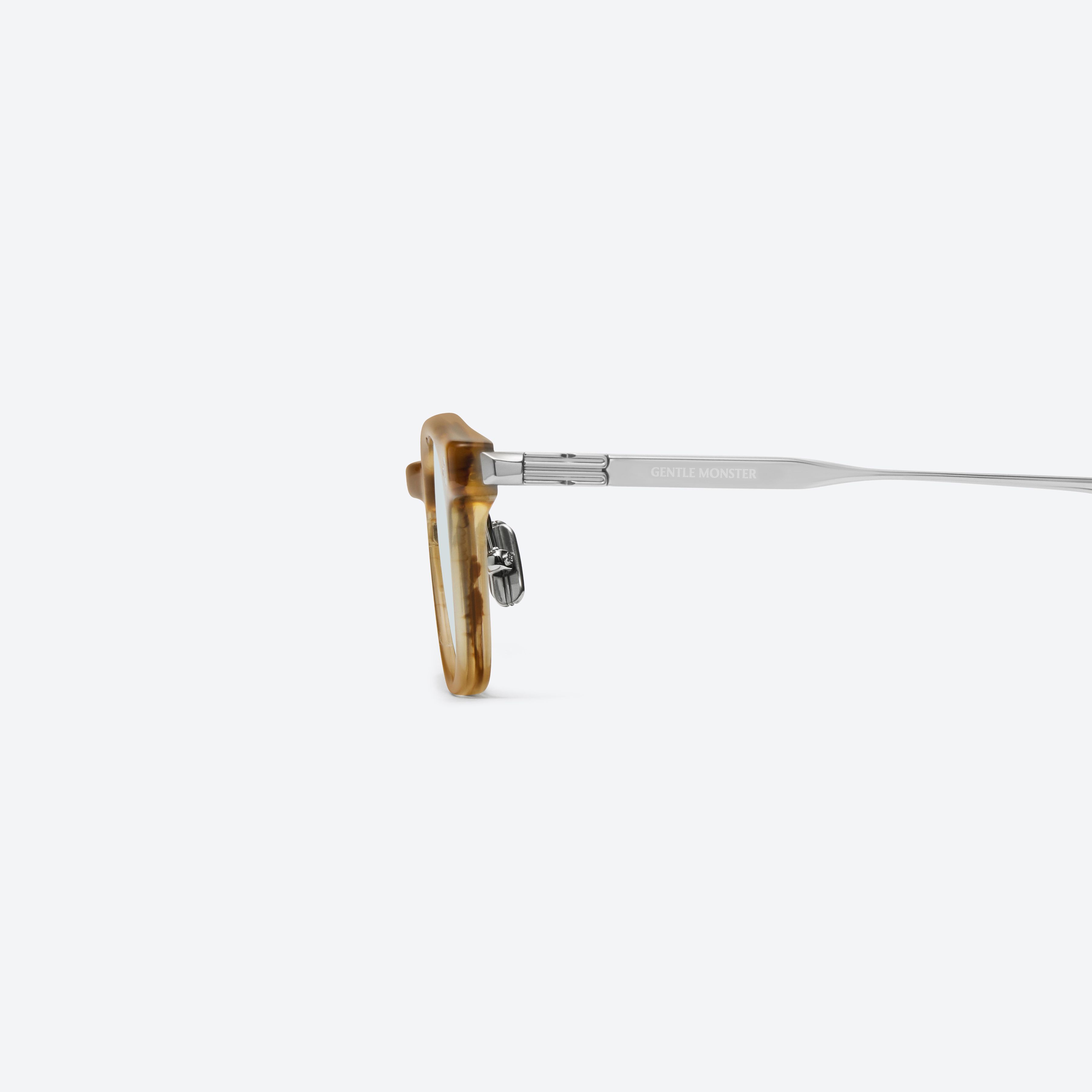 A detailed left view of Gentle Monster Saint B1 Brown Mixed framed Square sunglasses.