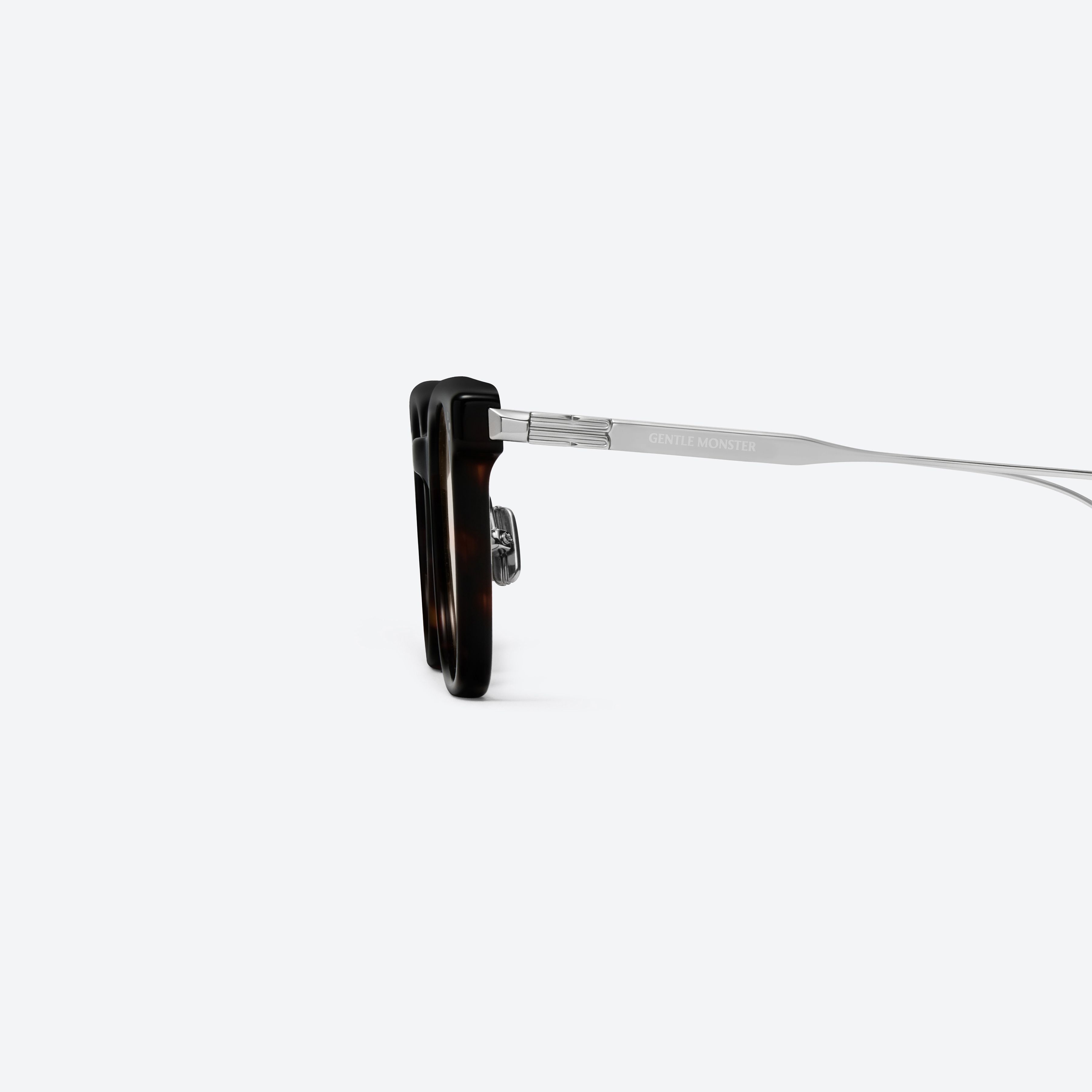 A detailed left view of Gentle Monster Noa T1 Tortoise Mixed framed Square sunglasses.
