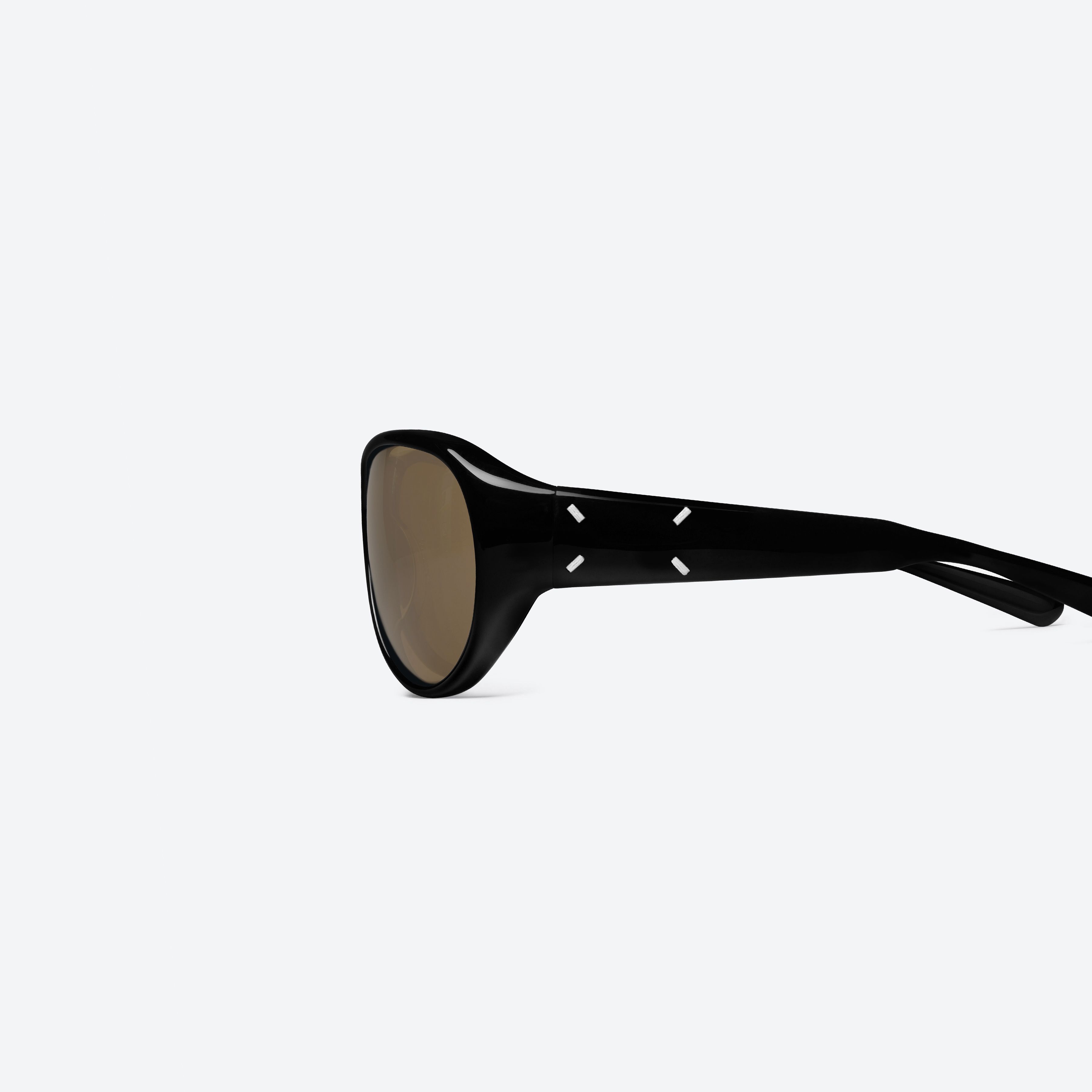 A detailed left view of Gentle Monster Maison Margiela - MM325S 01 Black Acetate framed Aviator sunglasses.