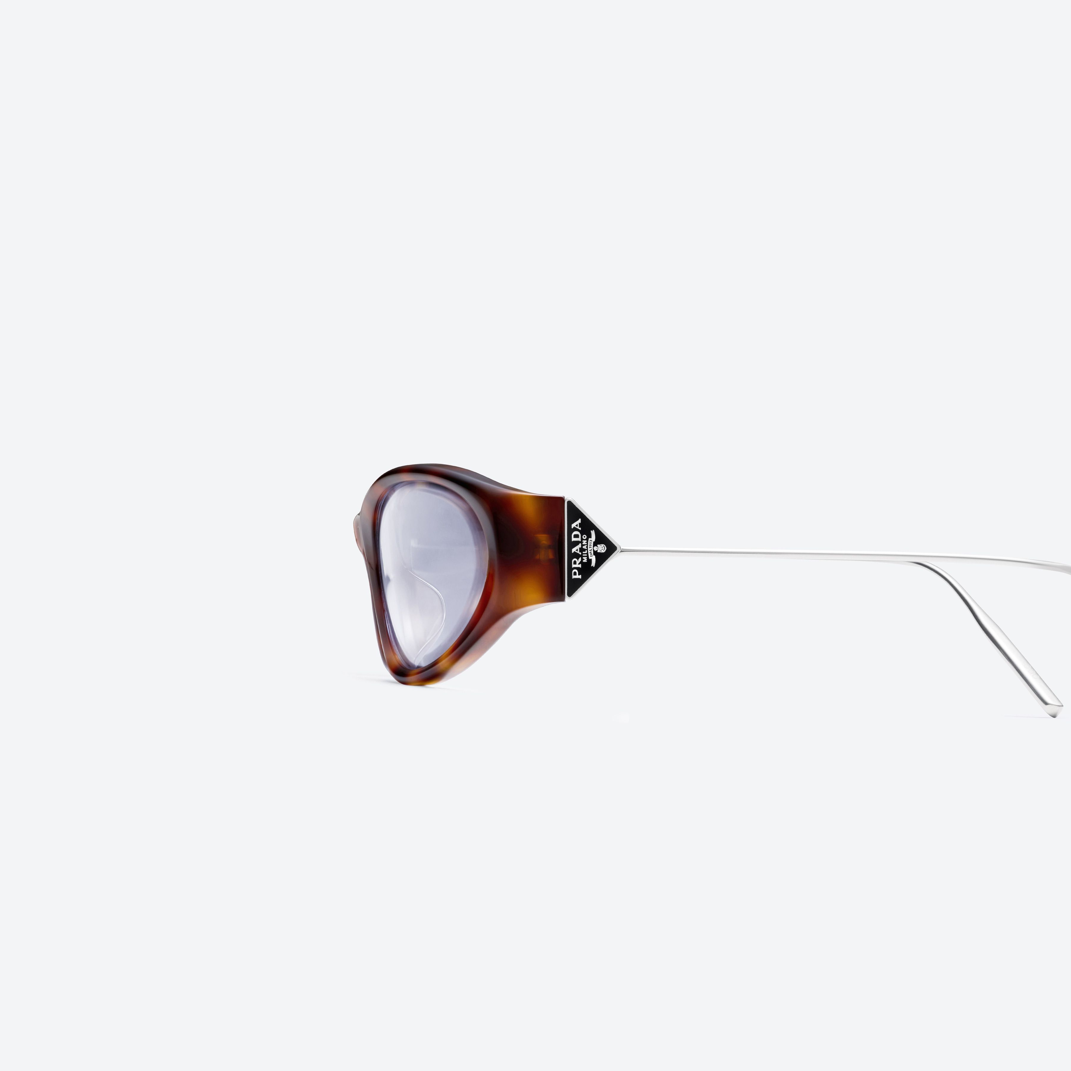 A detailed left view of Gentle Monster Prada Gentle Monster 3 L2 Tortoise Mixed framed Oval sunglasses.