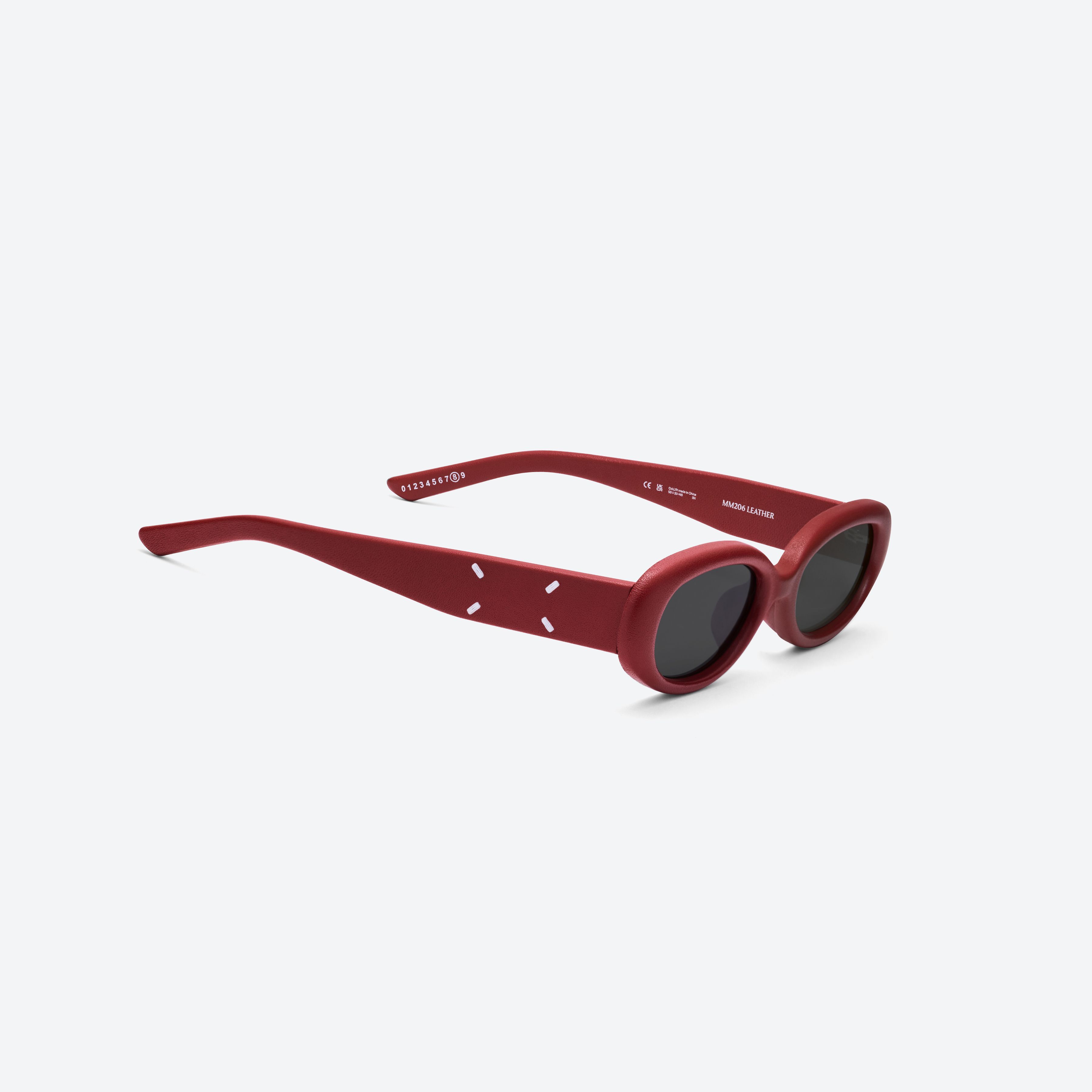 45-degree detailed view of Gentle Monster MM206 LEATHER LR1 Red Acetate framed Oval sunglasses.