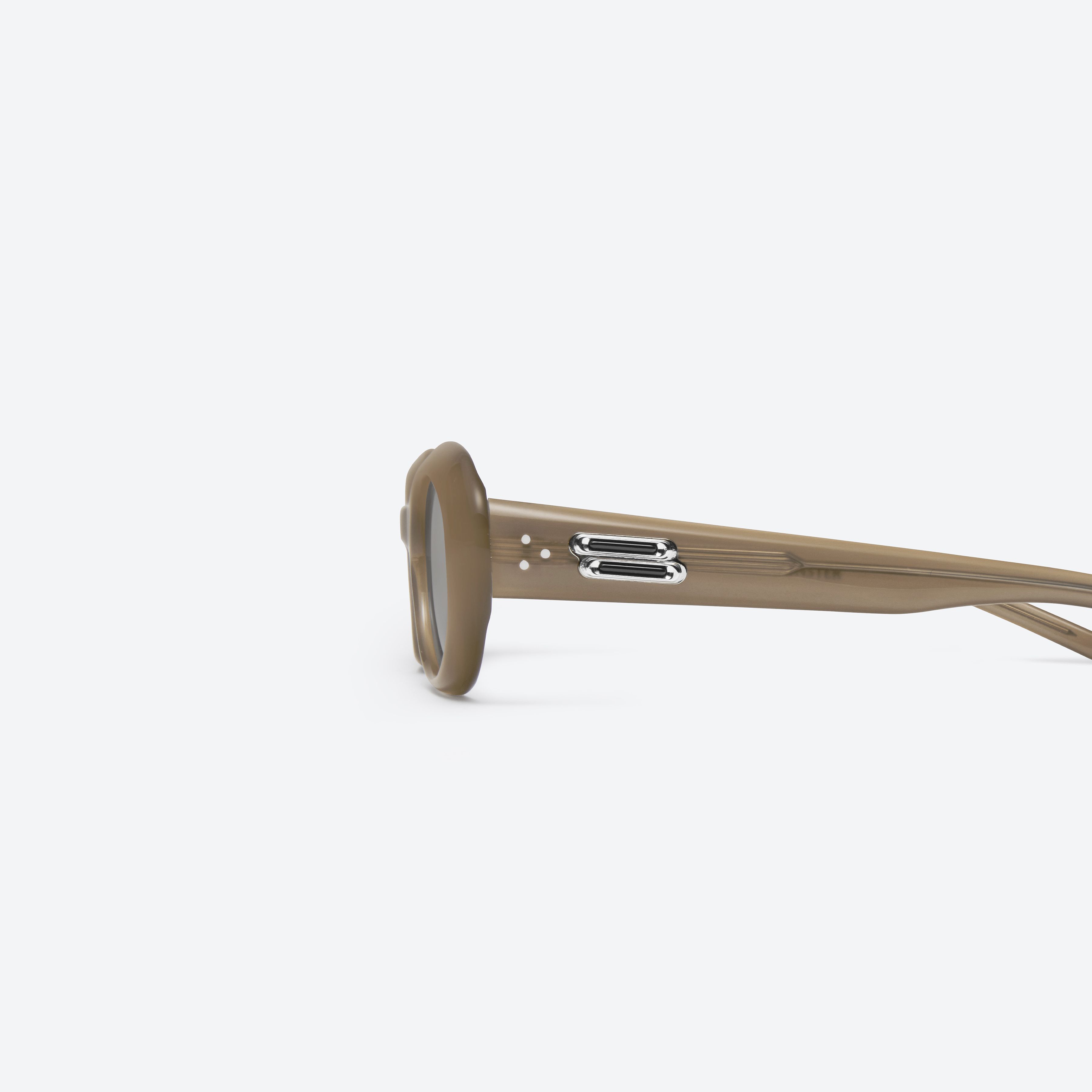 A detailed left view of Gentle Monster Molta BRC9 Similar Brown Acetate framed Oval sunglasses.
