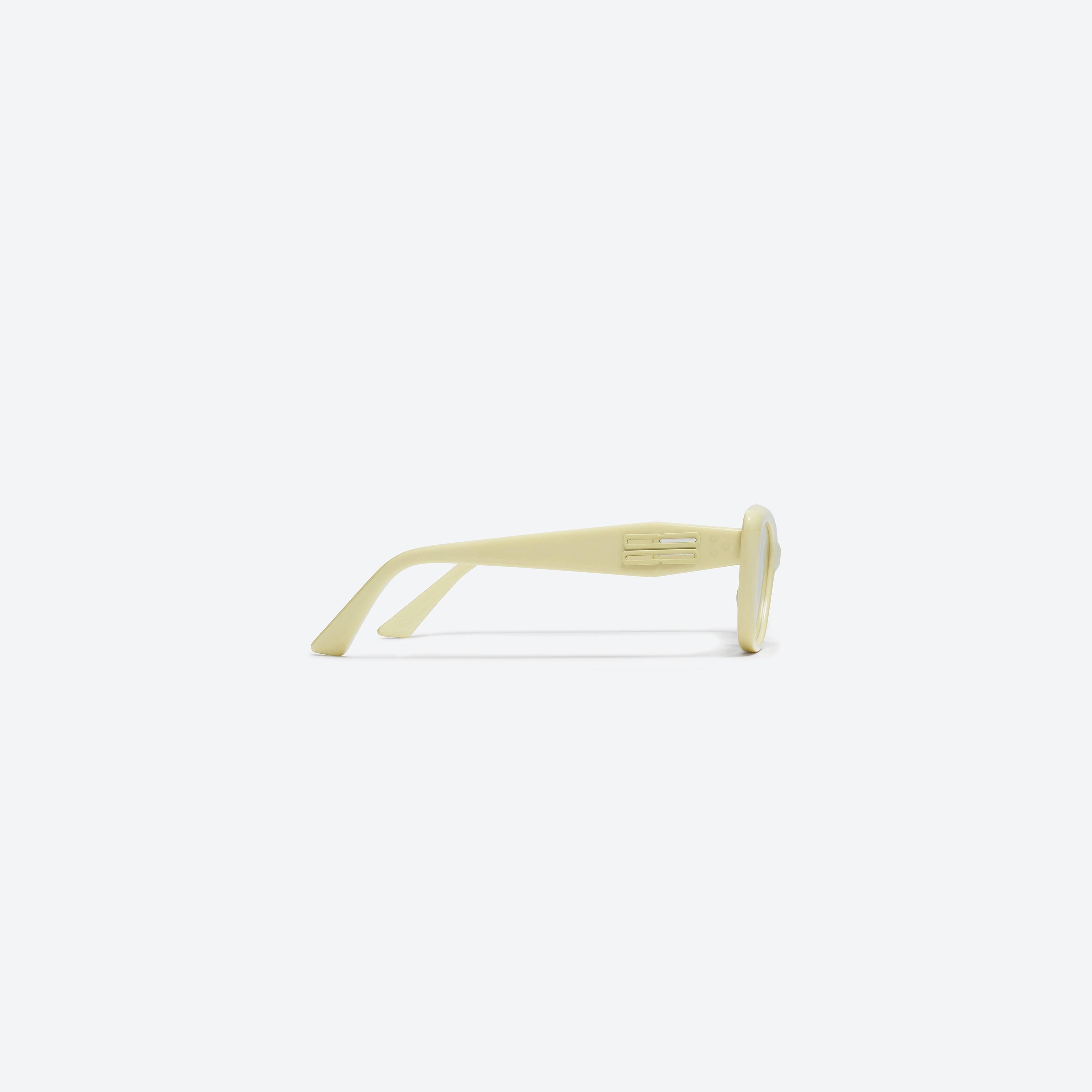 A detailed right view of Gentle Monster Amber Y5 Yellow Acetate framed Cat-eye sunglasses.