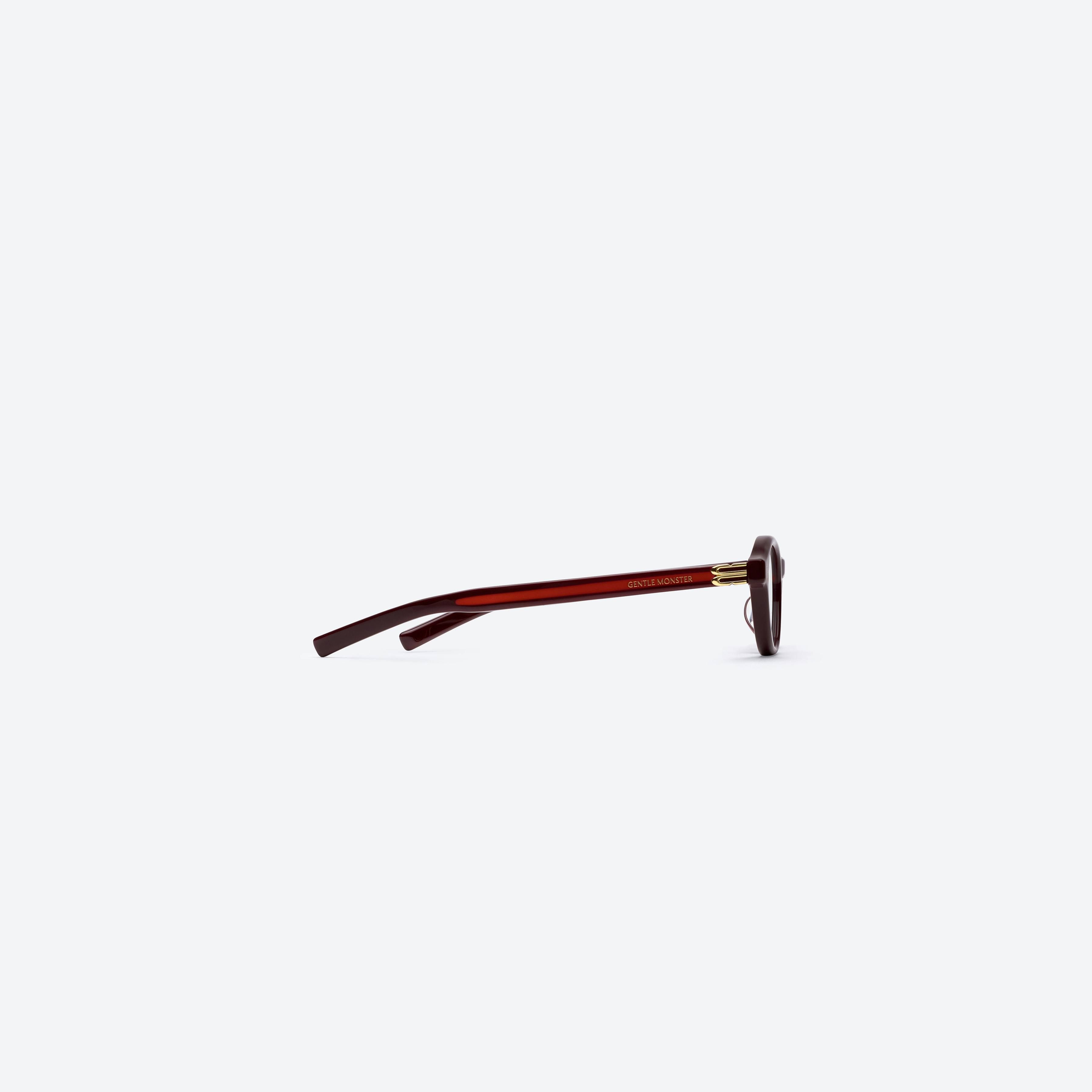 A detailed right view of Gentle Monster Lad R7 Red Acetate framed Round glasses.