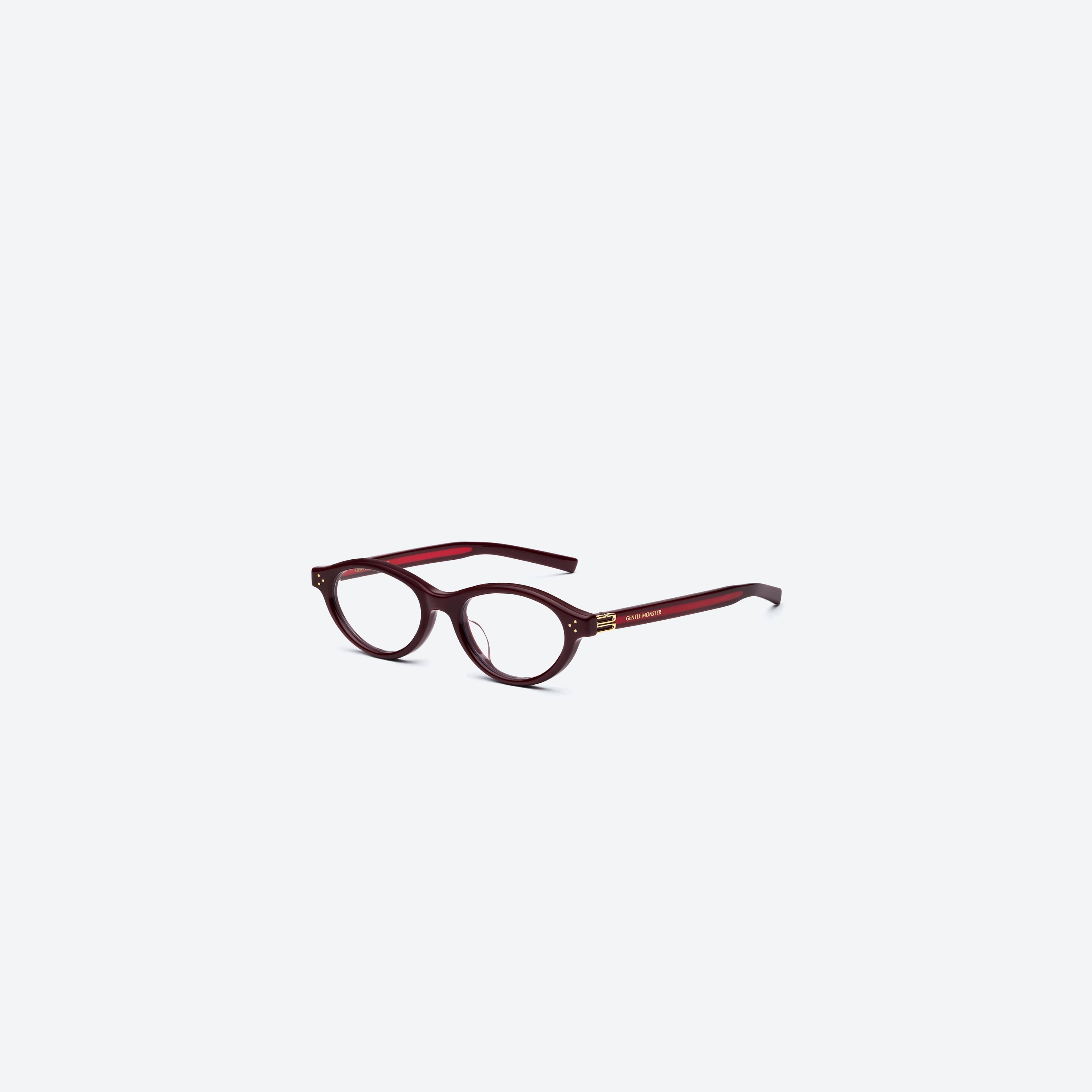 45-degree view of Gentle Monster Lad R7 Red Acetate framed Round glasses.