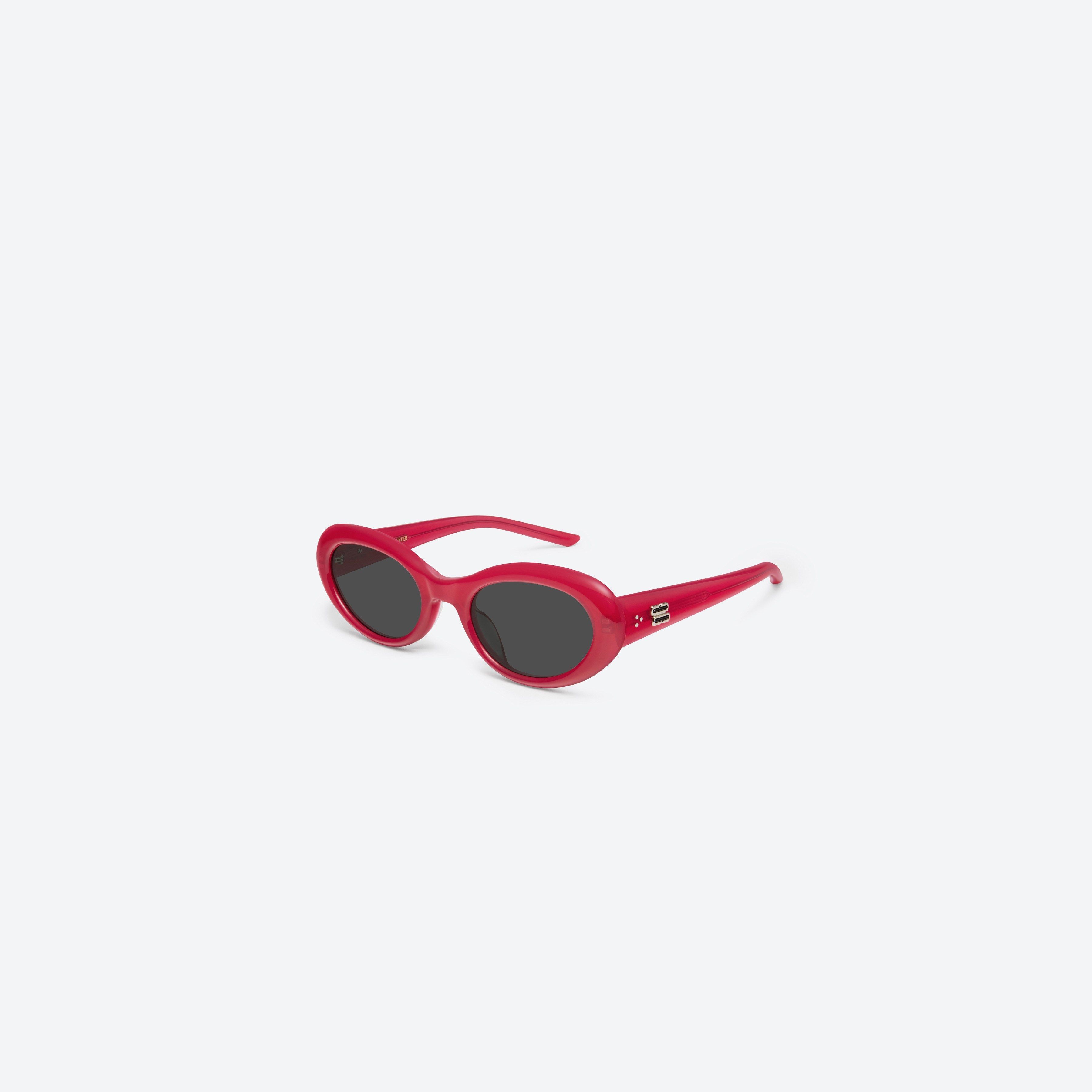 45-degree view of Gentle Monster Avon RC6 Red Acetate framed Oval sunglasses.