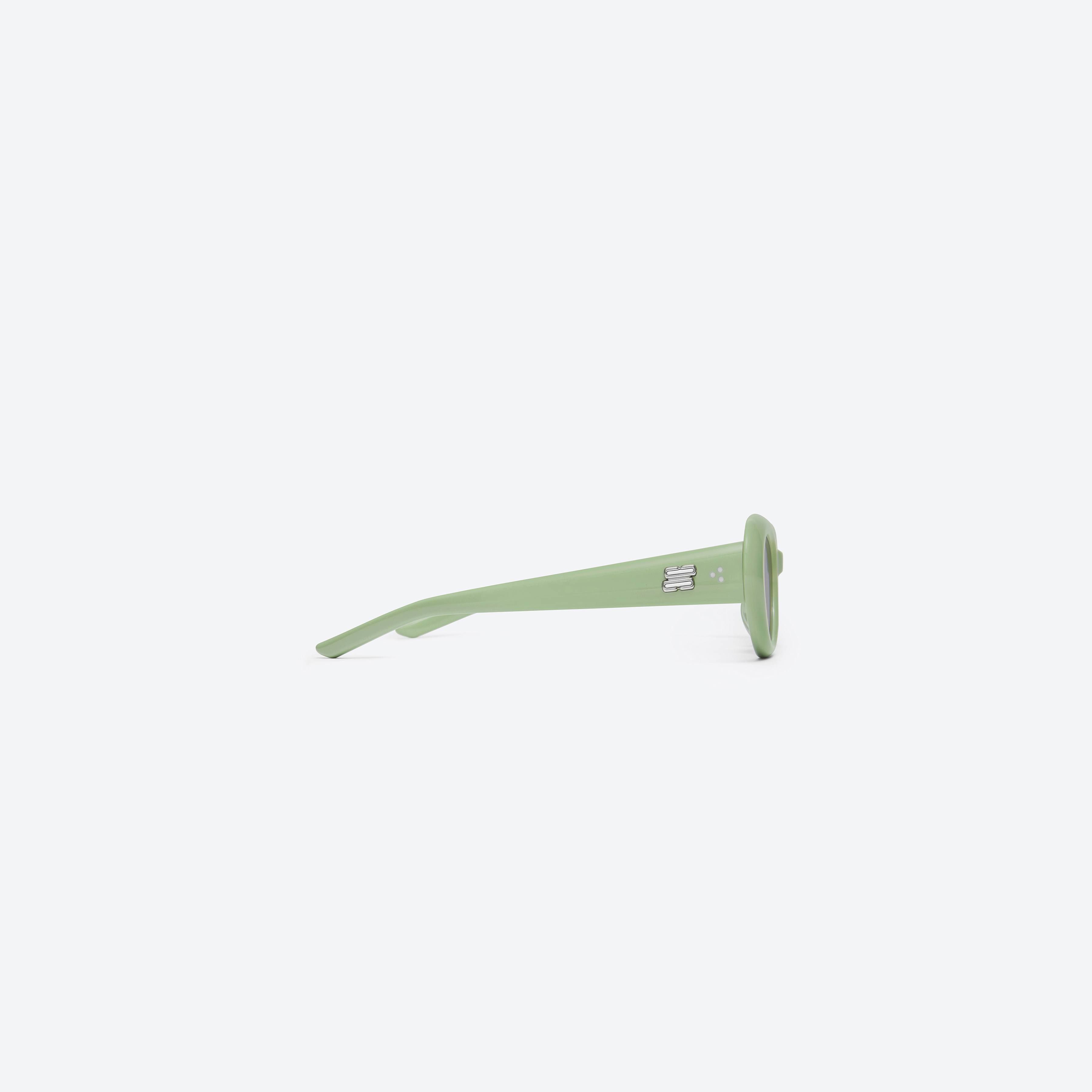 A detailed right view of Gentle Monster Avon GR8 Green Acetate framed Oval sunglasses.