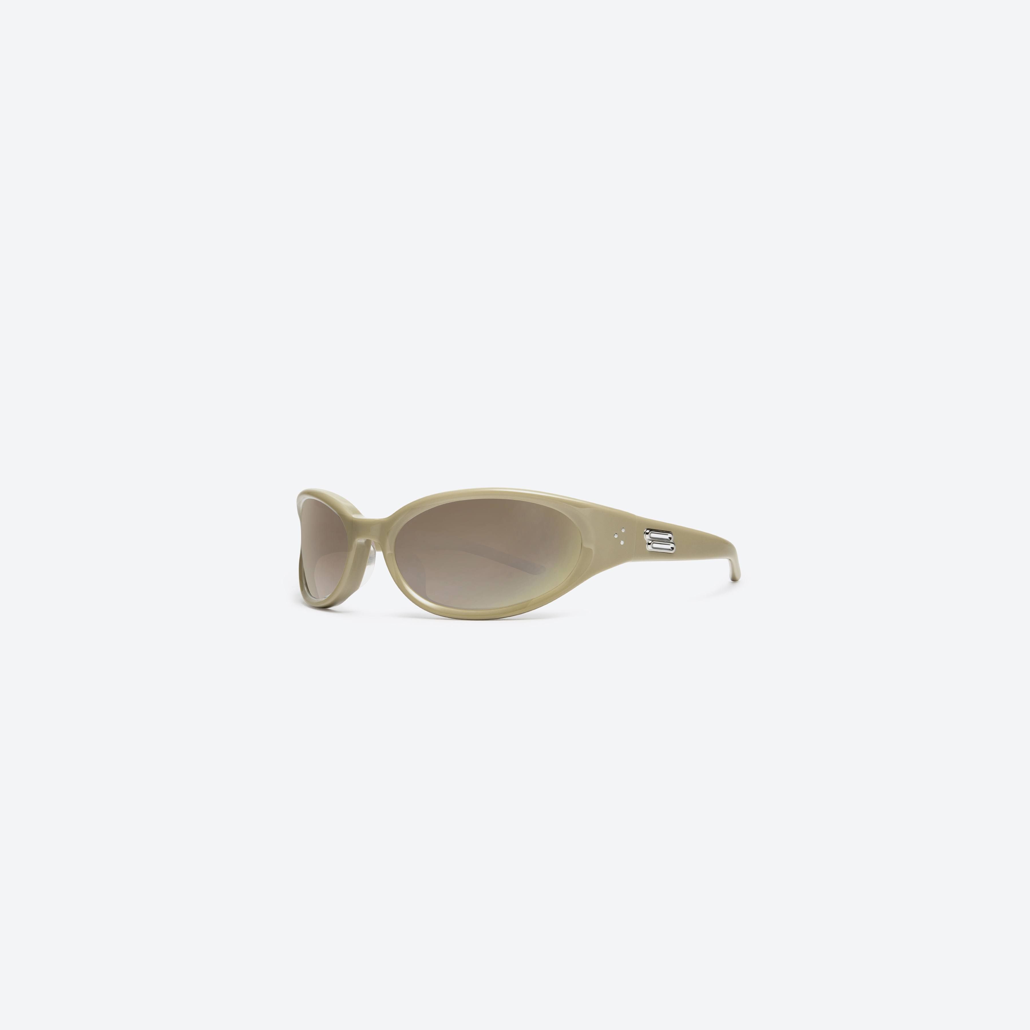 45-degree view of Gentle Monster Young Y10 Yellow Acetate framed Wraparound sunglasses.
