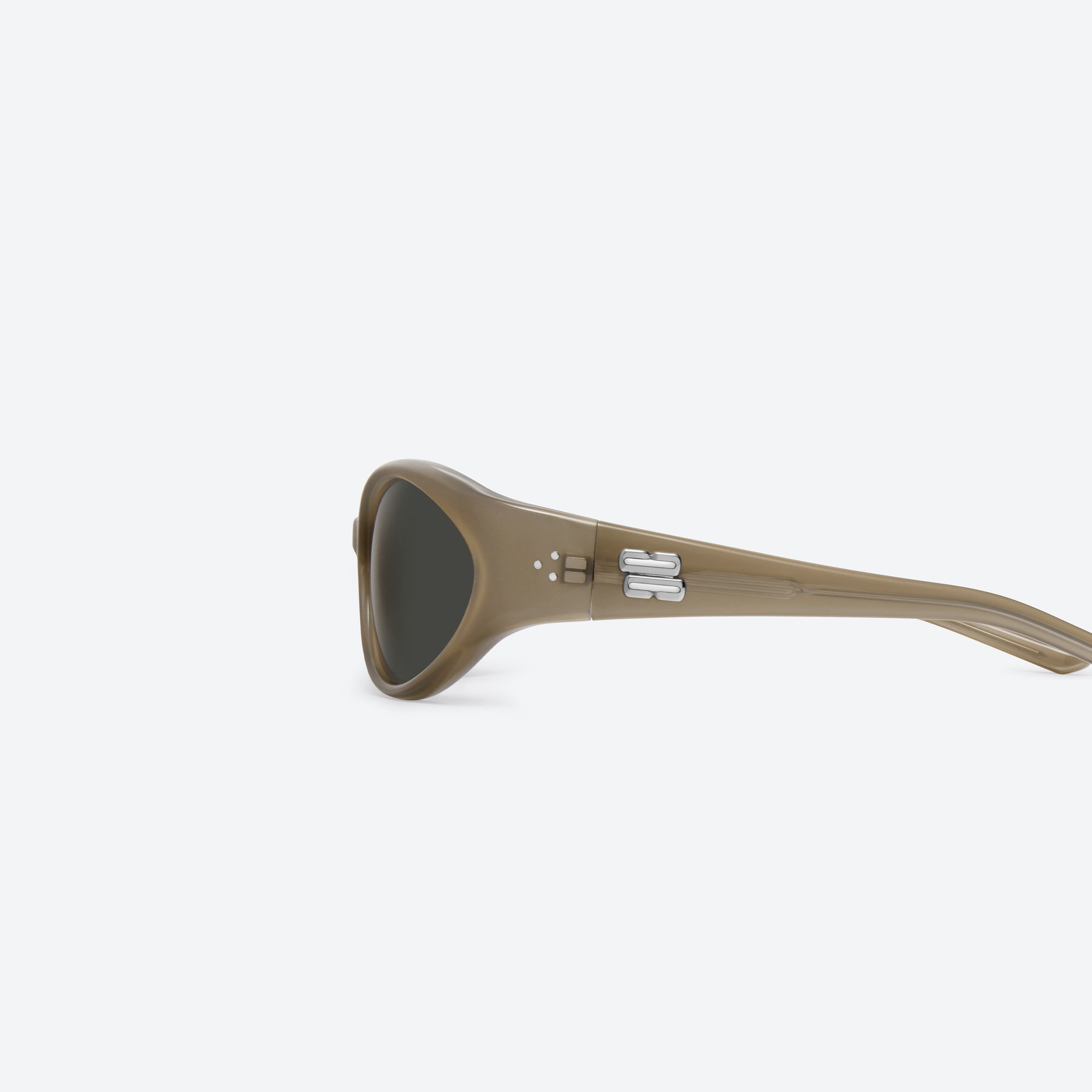 A detailed left view of Gentle Monster Sphere BRC9 Brown Acetate framed Wraparound sunglasses.