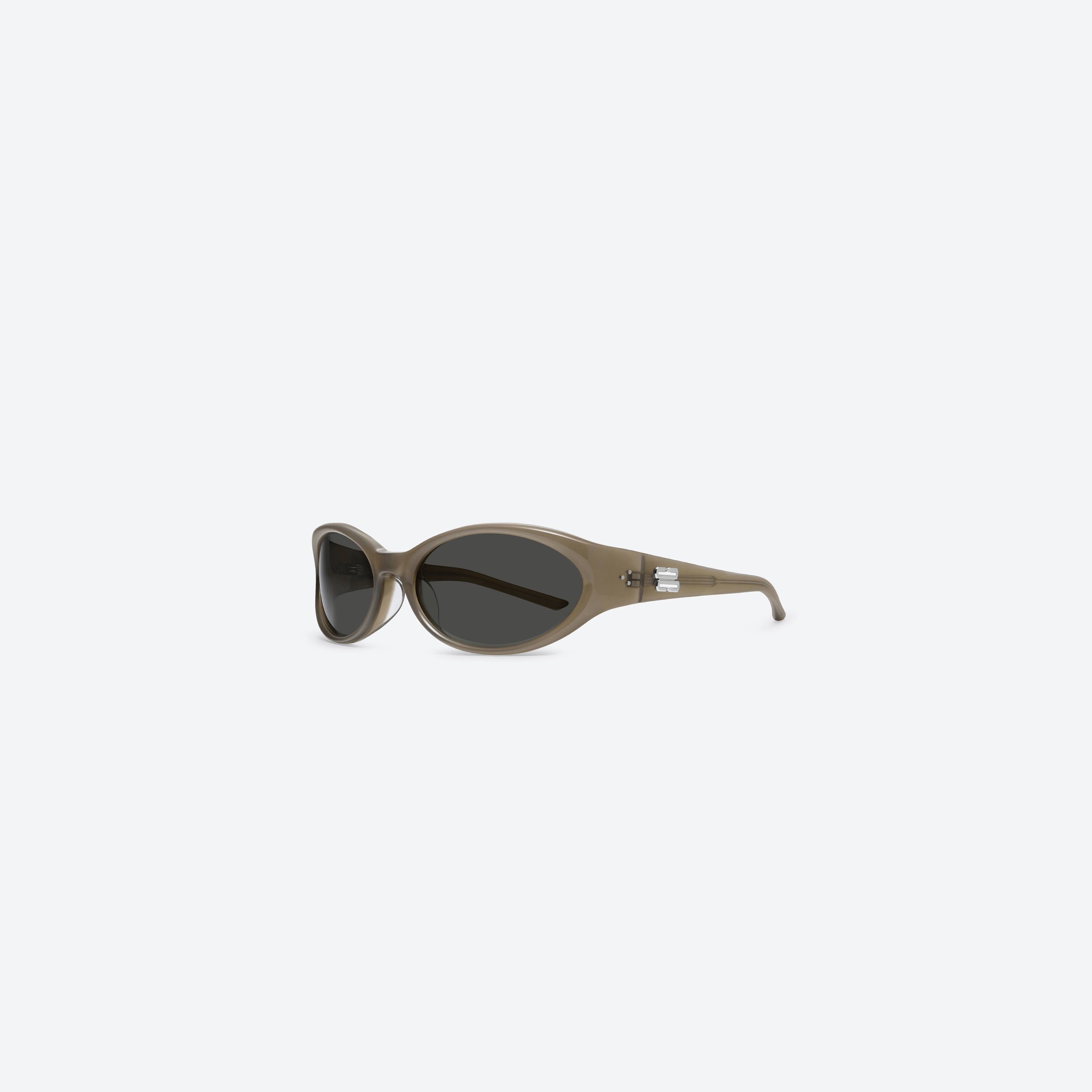 45-degree view of Gentle Monster Sphere BRC9 Brown Acetate framed Wraparound sunglasses.