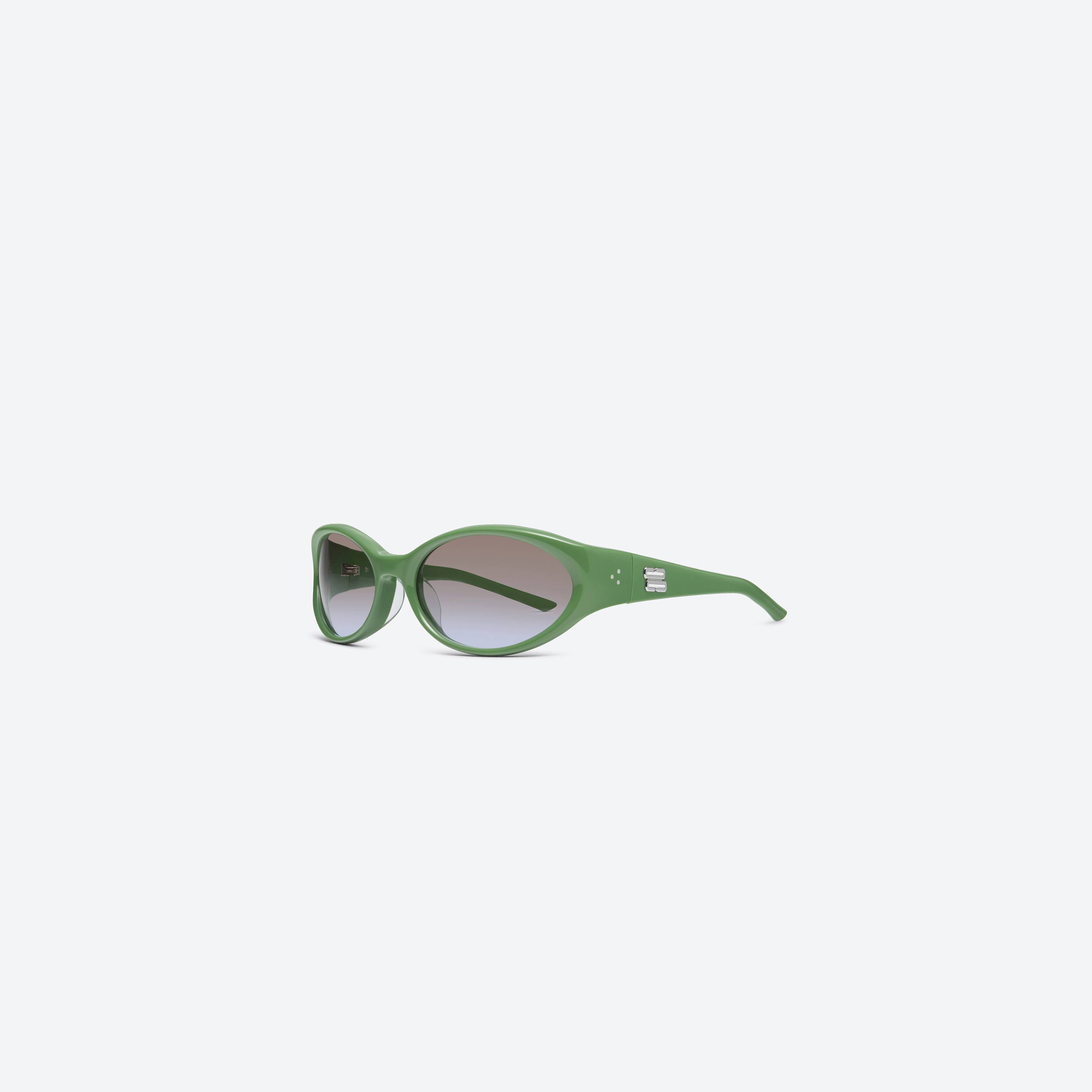 45-degree view of Gentle Monster Sphere GR7 Green Acetate framed Wraparound sunglasses.