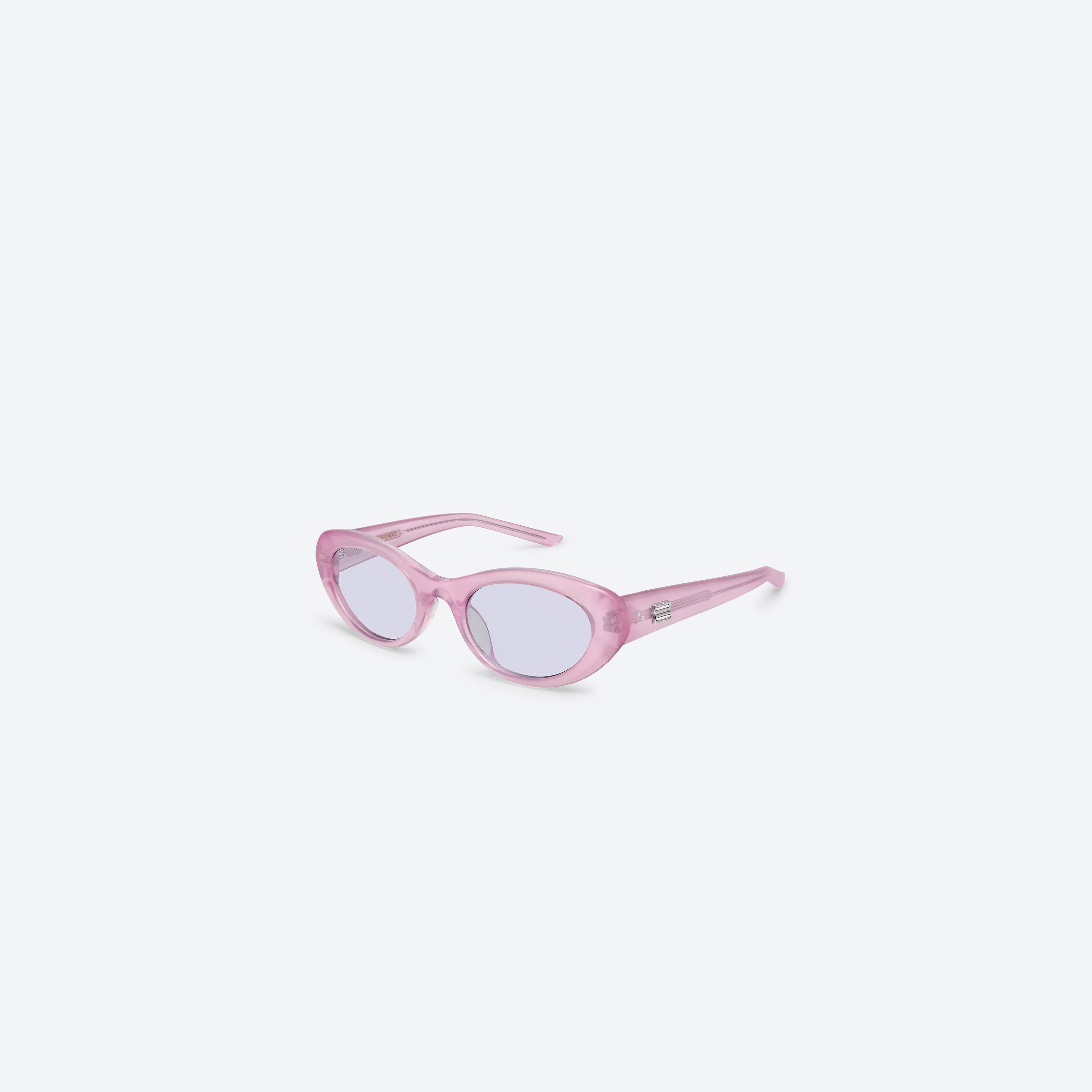 45-degree view of Gentle Monster Umber PC9 Pink Acetate framed Oval sunglasses.