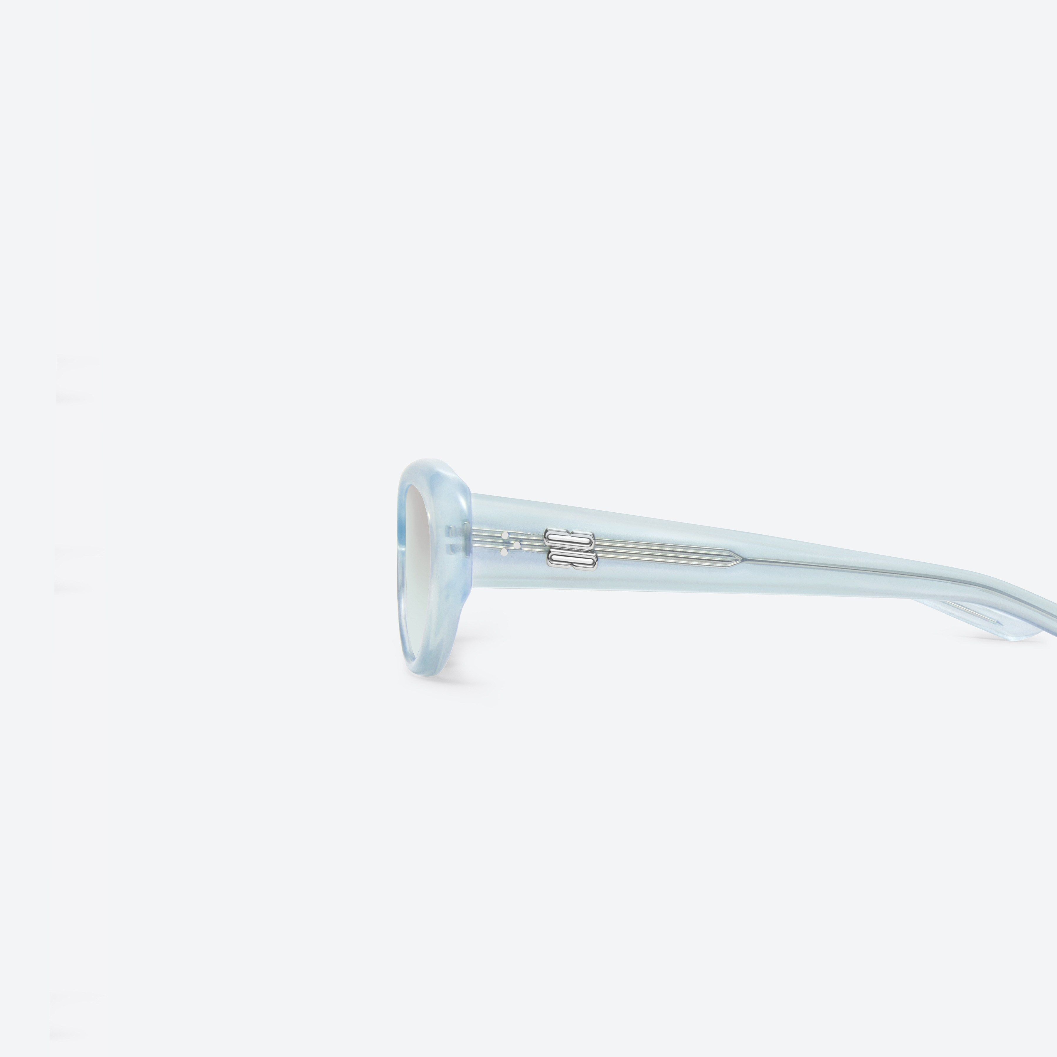 A detailed left view of Gentle Monster Umber BLC7 Blue Acetate framed Oval sunglasses.