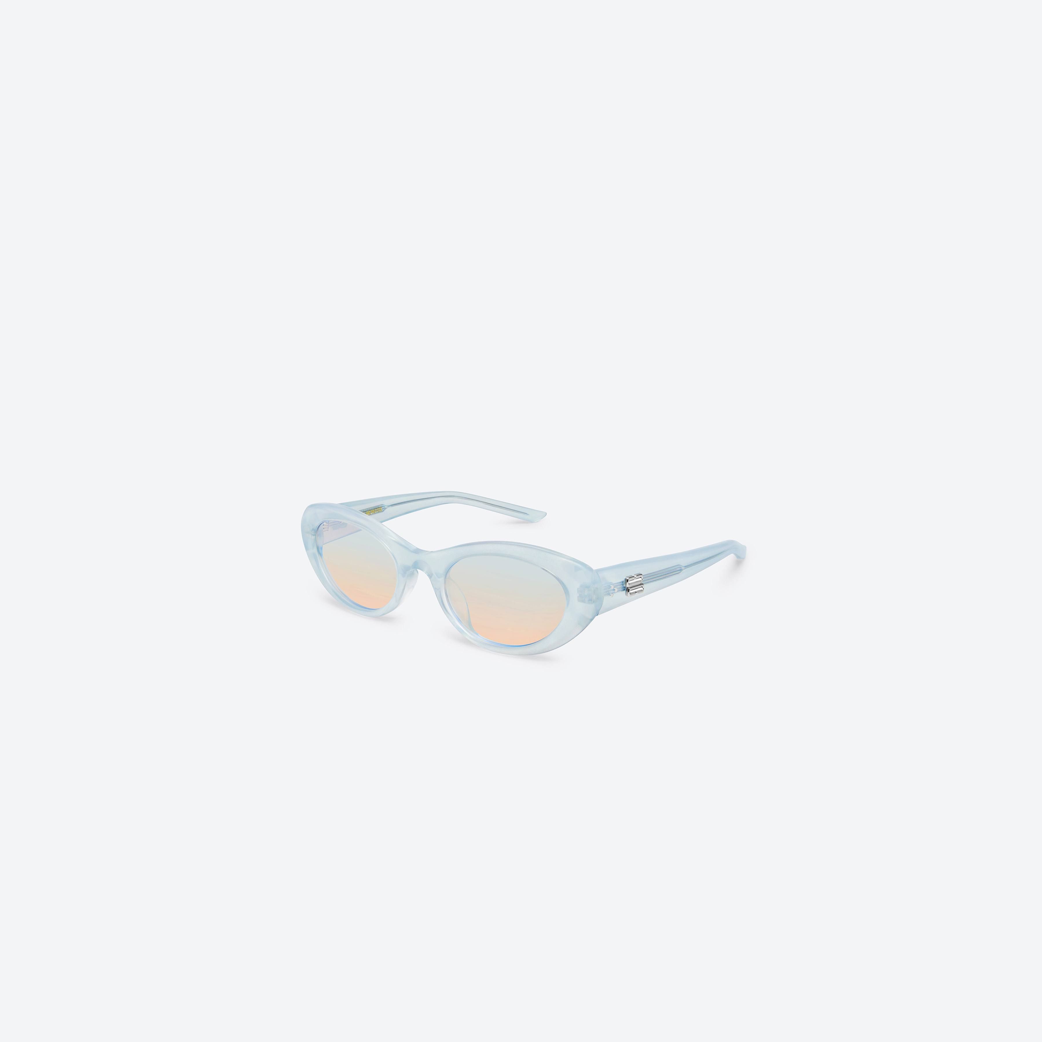 45-degree view of Gentle Monster Umber BLC7 Blue Acetate framed Oval sunglasses.