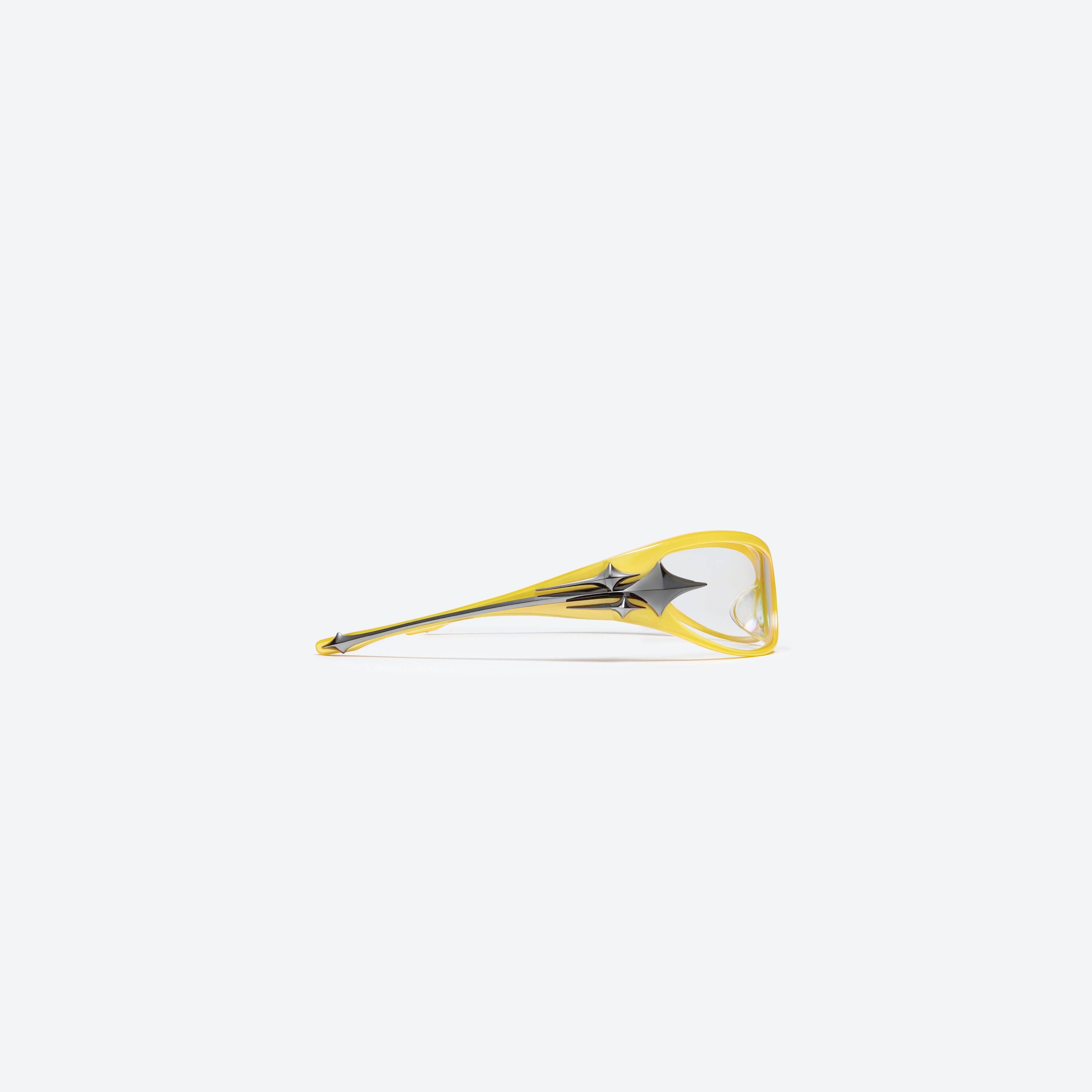 A detailed right view of Gentle Monster Third Kind Y8 Yellow Acetate framed Wraparound glasses.
