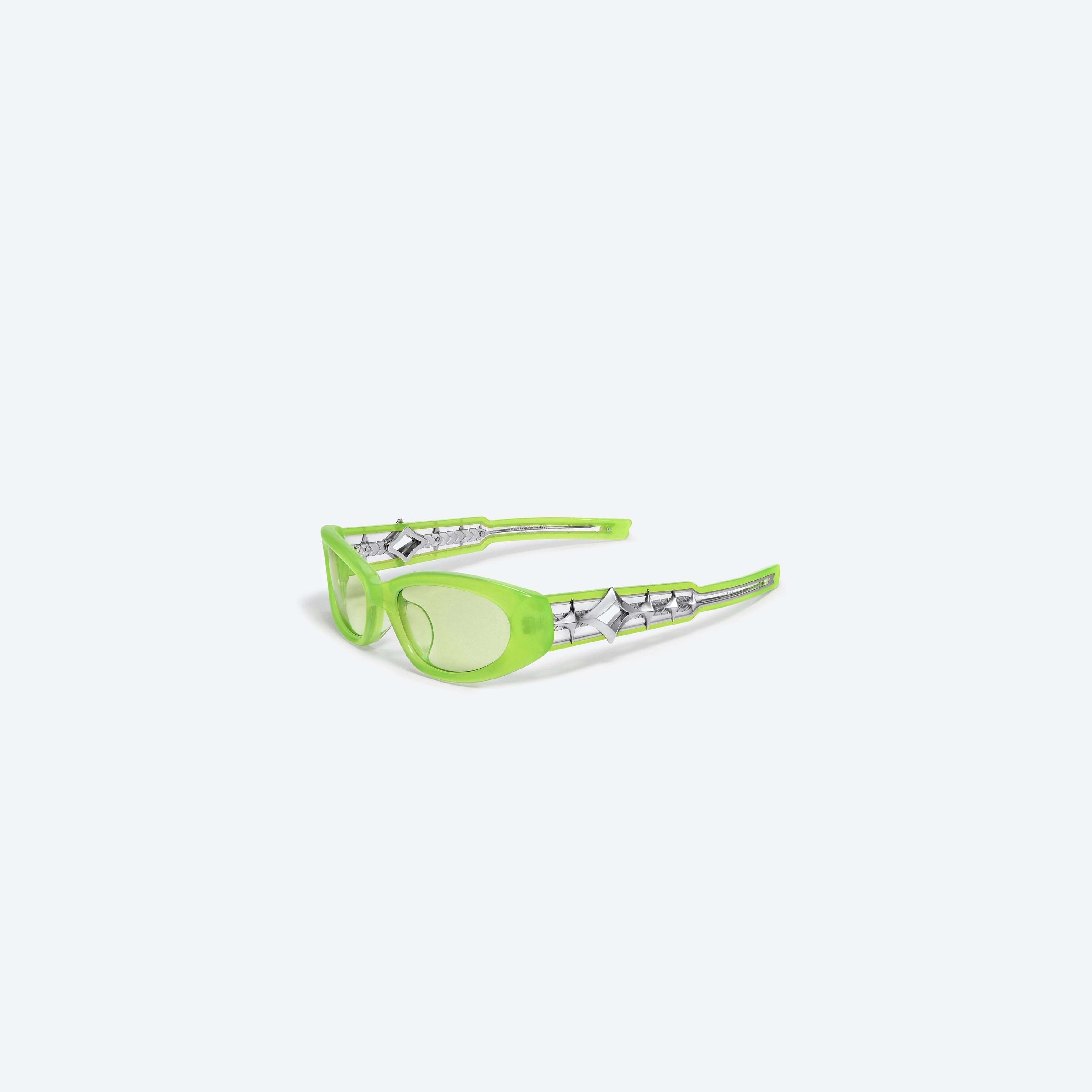 45-degree view of Gentle Monster Awave GRC3 Green Acetate framed Wraparound glasses.