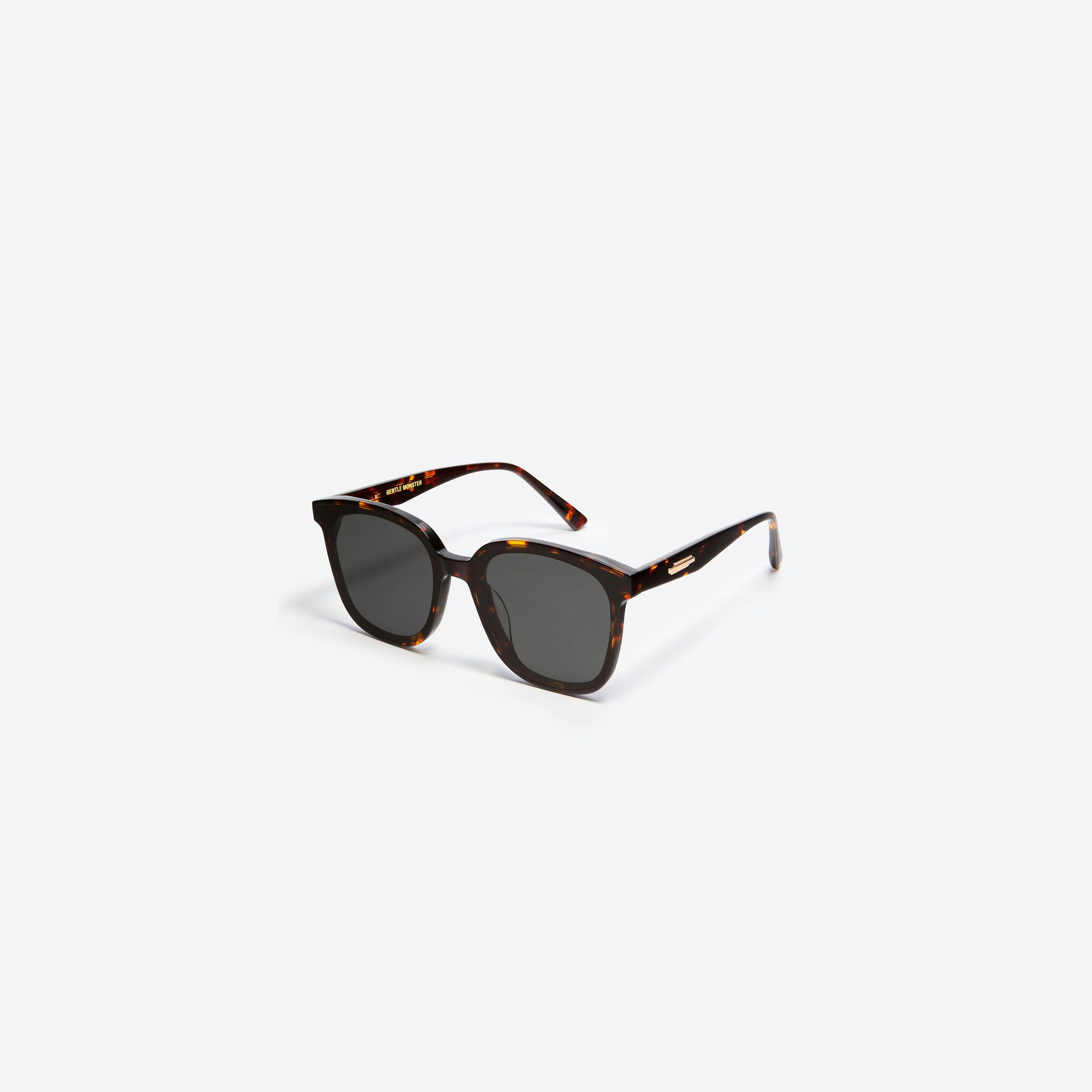45-degree view of Gentle Monster Jackie T1 Tortoise Acetate framed Square sunglasses.