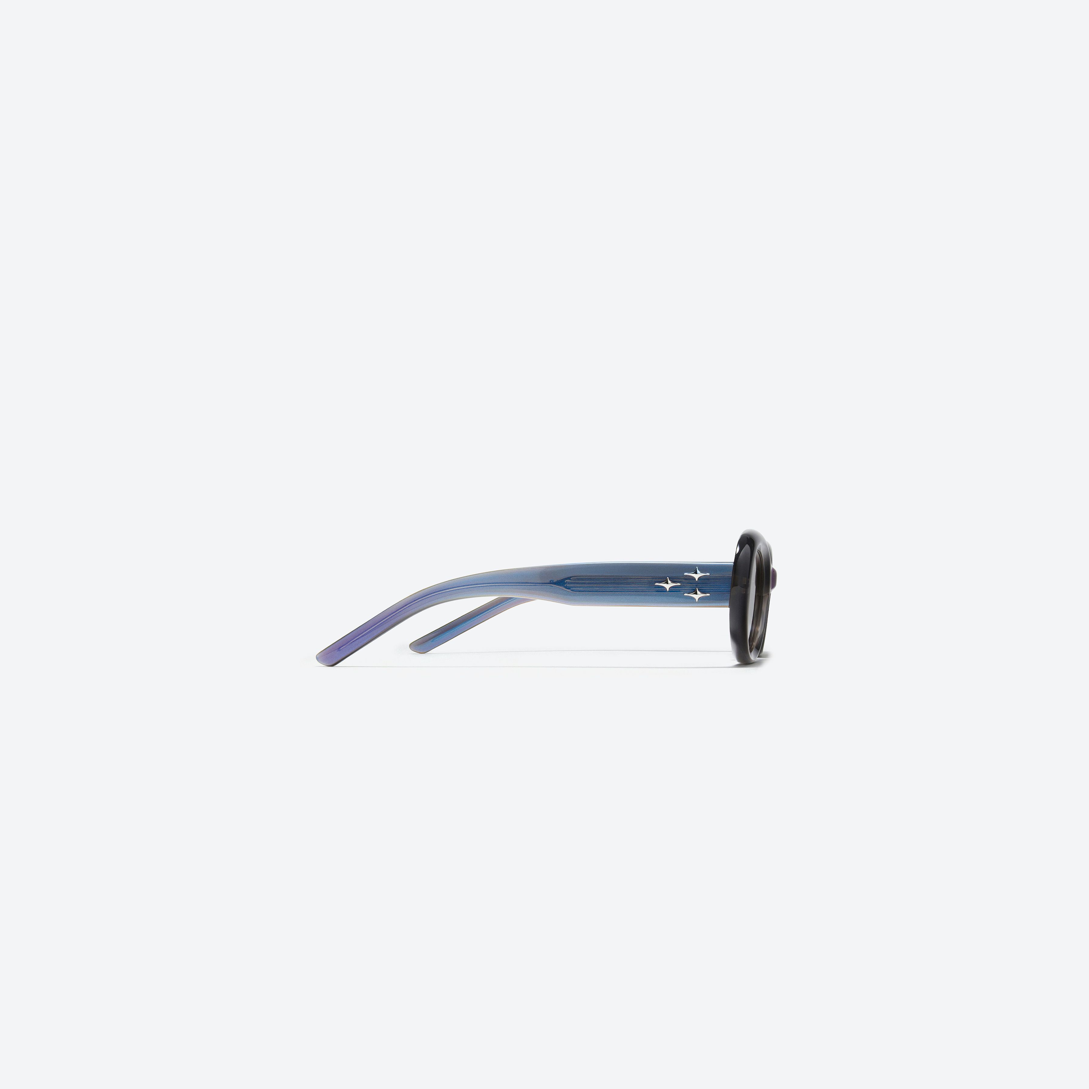 A detailed right view of Gentle Monster Eve BLC6 Blue Acetate framed Oval sunglasses.