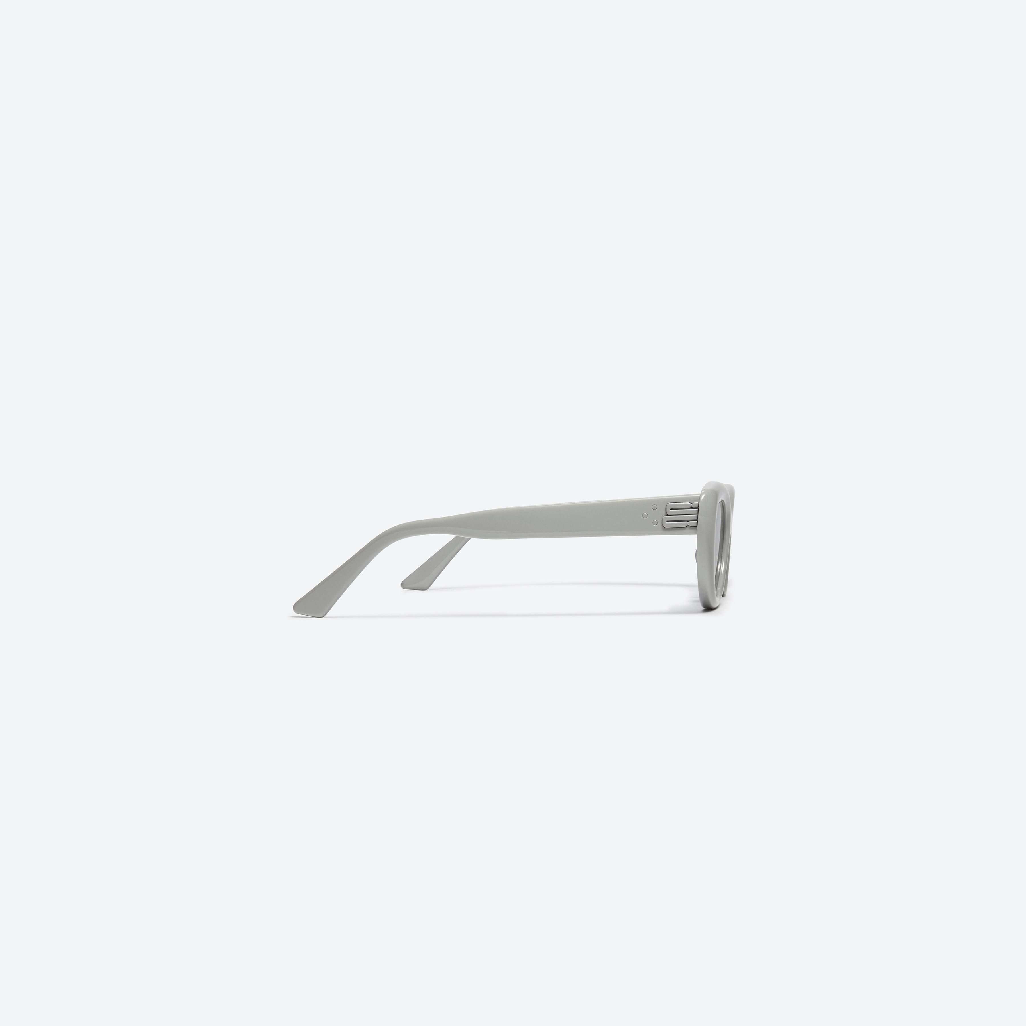 A detailed right view of Gentle Monster Conic G6 Gray Acetate framed Cat-eye sunglasses.